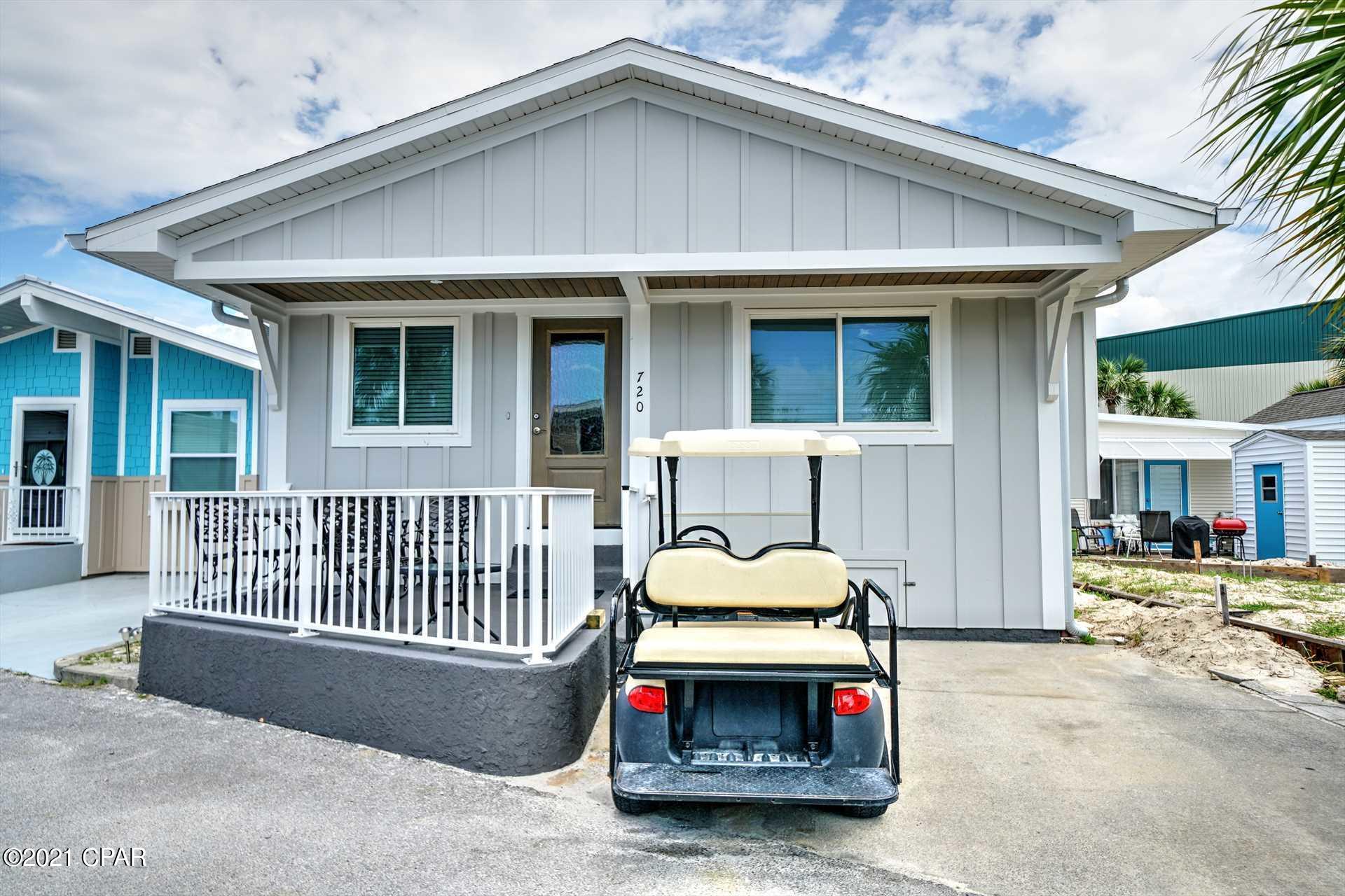 Check out this stunning 3 bedroom, 2 bath Venture Out home!  Seller has recently the replaced roof, added hardie board siding, hurricane rated windows, interior doors, installed new granite countertops, flooring and much more! This beauty will be sold completely furnished with a golf cart.  This is one is turn key and ready for you! Venture Out is a golf cart community that has exploded with popularity recently... With 300' on the beautiful pristine beaches of the Gulf of Mexico and 1,000' on the Grand Lagoon. Venture Out has something for everyone. With 2 pools, fishing pier, boat ramp, mini golf, children's play ground and much much more!