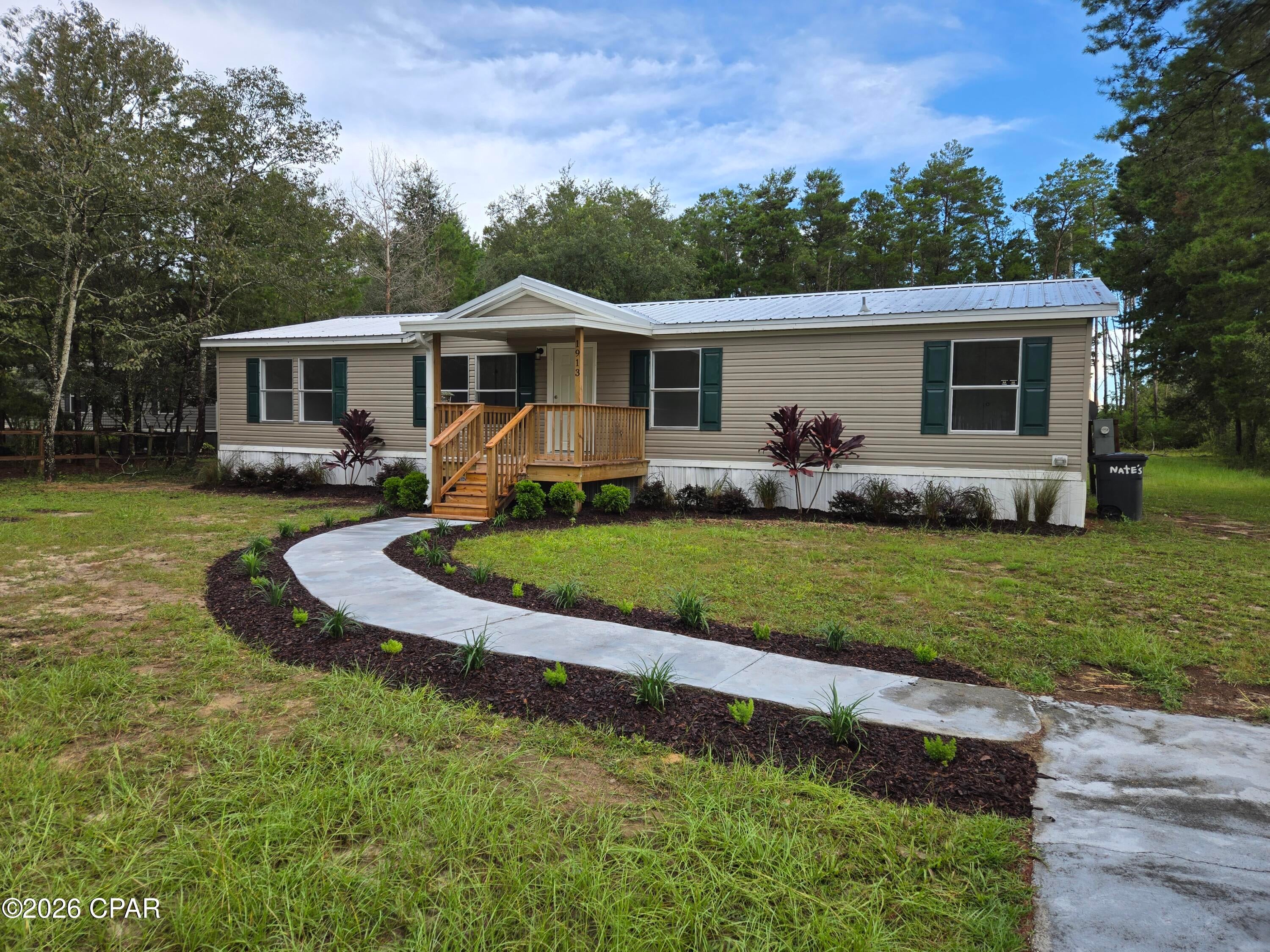Space to park TRUCKS/BOATS/RVs/WORK VEHICLES/TRAILERS!
A full 1 acre lot, in the country, but still close enough to all the city amenities to be convenient!
FULLY renovated 2004 doublewide!
4/2 open concept, split floorplan with 2 living rooms in 1512 sq ft!
Huge 1 acre lot!
▪️Brand new metal roof!
▪️New decks front & back!
▪️New doors front & back!
▪️Window replaced with a new sliding glass door!
▪️Central heating & AC!
▪️Wall removed to create a wide open concept floor plan!
▪️Fresh paint throughout!
▪️New LVP flooring throughout!
▪️Replaced kitchen cabinetry & installed a butcher block kitchen island!
▪️Updated electrical outlet & light switches throughout!
▪️Brand new toilets in both bathrooms!
▪️Replaced both bathroom vanities!
▪️New light fixtures throughout!
▪️New ceiling fans in all rooms!
▪️New blinds going in on all windows!
▪️Washer & Dryer included!
▪️Fresh new landscaping with automatic drip system for watering the plants!

Includes weekly garbage collection, lawn care as needed & quarterly pest control.
On a well & septic - so no water/sewer bill only electricity which runs on average about $200/month (based on usage)!

Virtually staged some photos for design & furniture ideas!