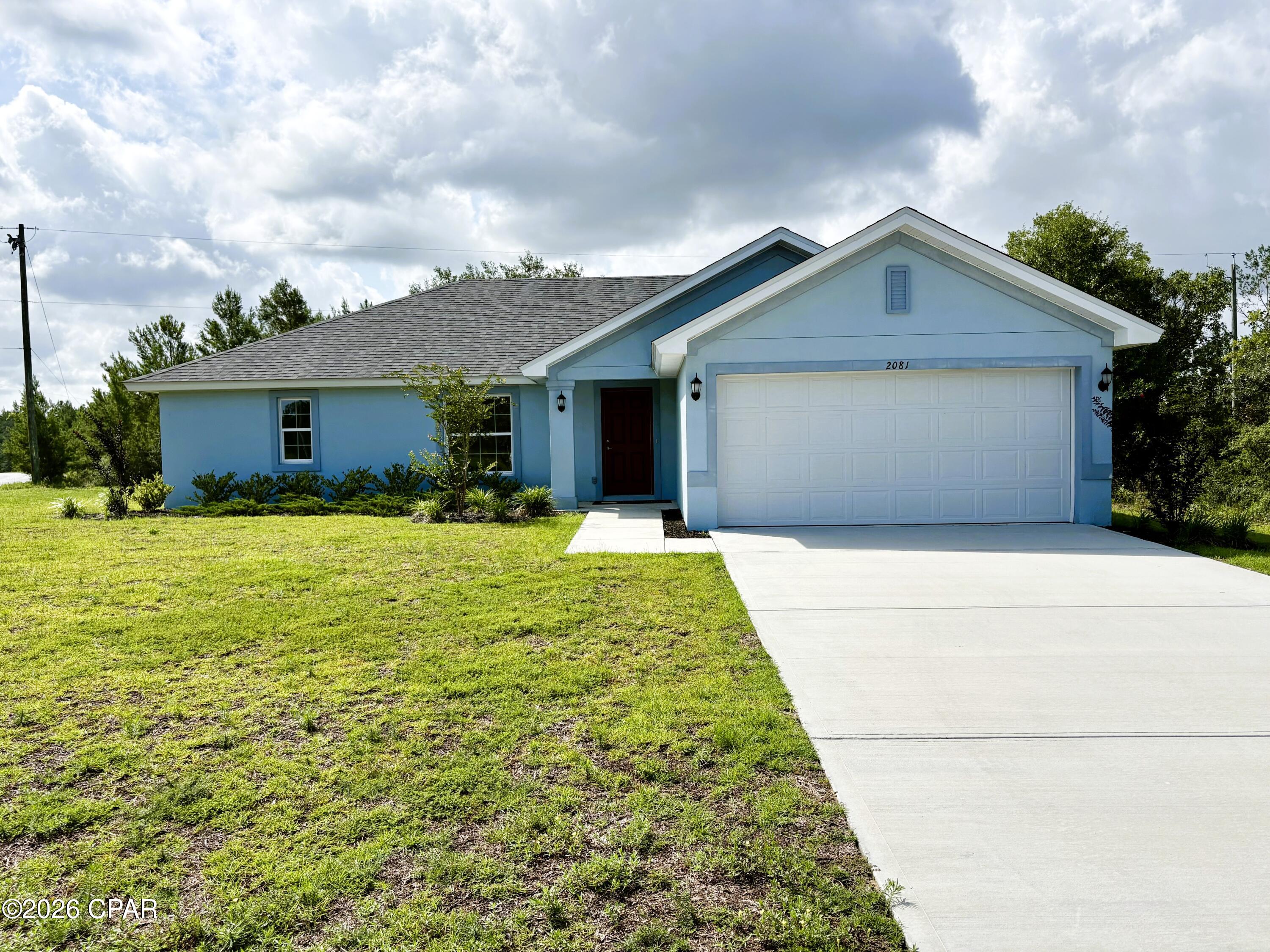 Seize the opportunity to own the Hyacinth model by Homes by Deltona--beautifully situated in the tranquil community of Sunny Hills. This three-bedroom, two-bathroom gem is not just a house, but a showcase of standard features. As you step inside, you're greeted by a spacious open concept living area and a vaulted ceiling that elevates the home's aesthetic. The kitchen, designed to satisfy any culinary enthusiast, boasts a central island, sleek granite countertops, and state-of-the-art GE appliances such as a garbage disposal, dishwasher, range, and over-the-range microwave. The home features luxurious and practical luxury vinyl plank (LVP) flooring throughout the living areas, enhancing both style and durability. Each bedroom creates an open and airy atmosphere, complemented by soft, cozy carpeting for a serene escape. Constructed with sturdy concrete block, this residence promises durability and longevity. The intelligent split bedroom floor plan provides privacy and comfort, with a master suite that includes a large walk-in closet and dual vanity sinks--ideal for relaxation. Step outside to a professionally landscaped yard with an efficient irrigation system, ensuring that your green space thrives beautifully all year long. Additionally, enjoy the confidence that comes with a 2-10-year builder's warranty. Located in the peaceful Sunny Hills, just brief drive from the stunning beaches of the Emerald Coast, this model home is a perfect blend of tranquility and accessibility. Don't miss out on making the Hyacinth floorplan your forever home!