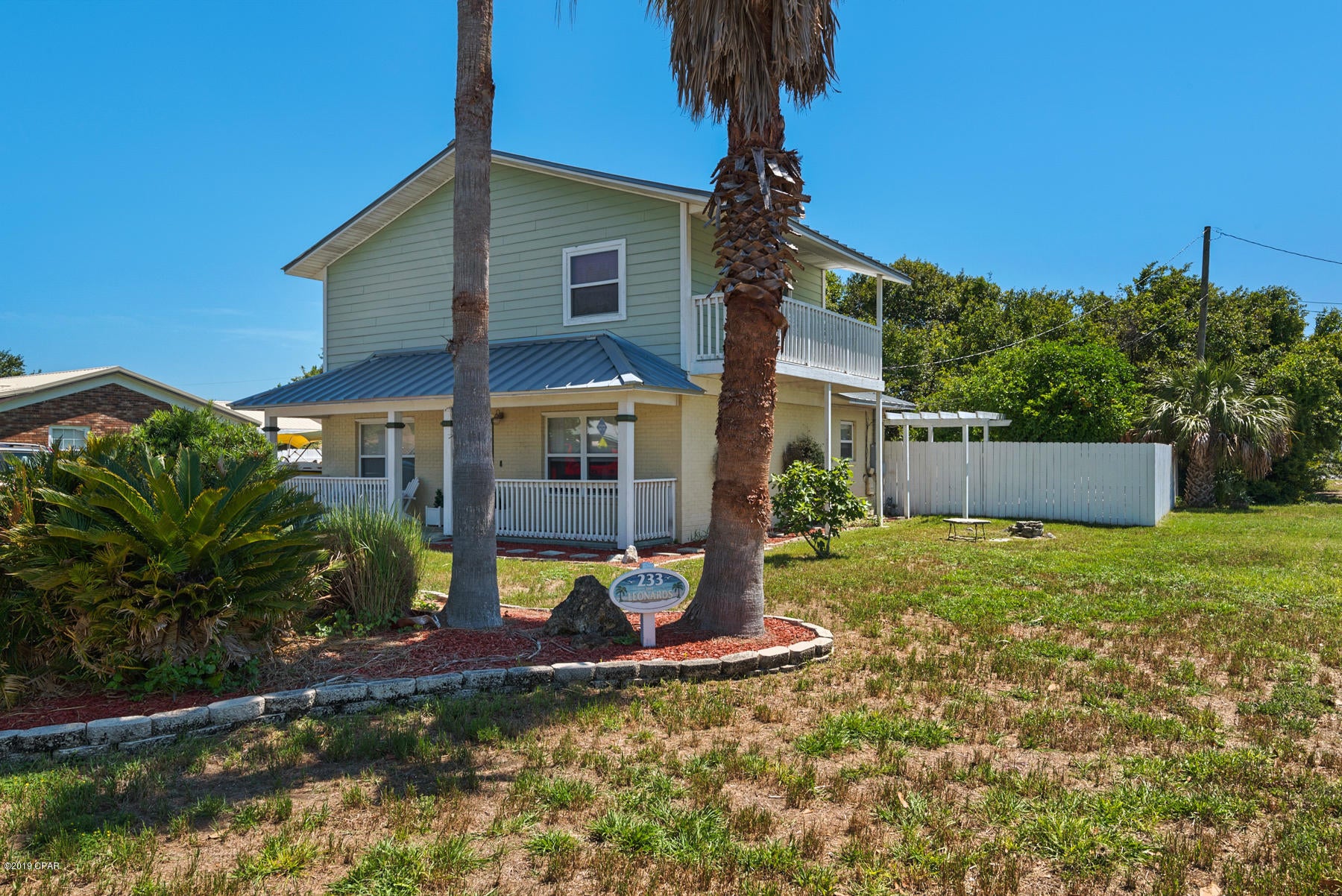 This 3 BR 2 Bath home is only about 2 blocks from the beach in El Centro. Nicely landscaped and well maintained. The fenced backyard pool with fountain feature is an oasis from the heat and will be the focal point of your outdoor entertaining and there's also a fire pit for when the season changes. The entire second floor is your spacious master retreat, complete with a gas fireplace and a balcony. The location is super convenient to shopping, Pier Park, Frank Brown Park and the beach.