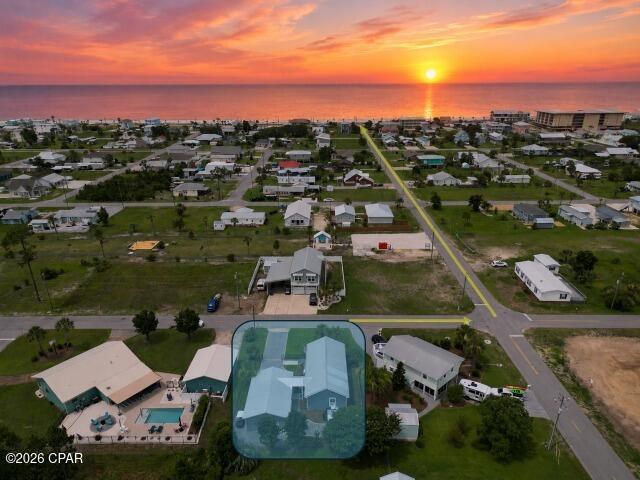 Located just three blocks from the white sand beaches of Mexico Beach, this furnished 2-bedroom, 2-bath coastal cottage offers the flexibility of a primary residence, second home, or vacation rental. Built in 2019, this detached home has no HOA and is located in desirable Flood Zone X. Offering nearly 1,000 square feet of heated and cooled living space, the home features an open floor plan with wood-look ceramic tile flooring throughout, granite countertops, soft-close cabinetry, a natural gas range, built-in microwave, tankless natural gas water heater, and an energy-efficient Mitsubishi mini-split HVAC system with individual climate control in the living area and both bedrooms. A screened front porch provides a comfortable place to enjoy your morning coffee, while the fenced backyard includes a fire pit, covered breezeway, irrigation system, and enclosed pet area. The oversized carport and rolling gate offer convenient parking for vehicles, golf carts, or water toys. Additional heated and cooled bonus spaces include a 9x9 flex room ideal for a home office, hobby room, or studio, plus a separate 10x10 ''bunk'' room for additional sleeping space. A 12x12 storage building with built-in shelving and an additional storage loft provides ample room for beach gear, tools, and outdoor equipment. Sold fully furnished with only minor exclusions; this home is move-in and rental ready. Located within a short stroll or golf cart ride to the beach, Mexico Beach Market, local restaurants, and shopping, you'll enjoy the relaxed coastal lifestyle that makes Mexico Beach one of Florida's favorite Gulf Coast communities.