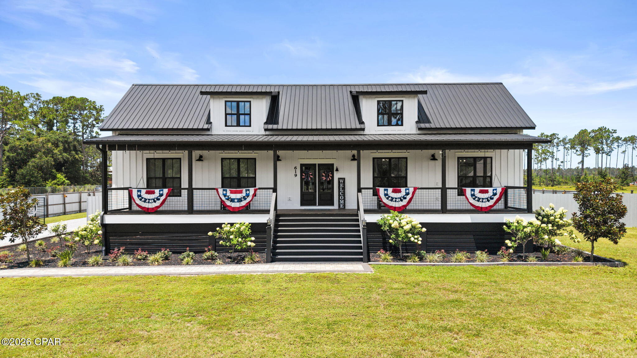 CUSTOM FARMHOUSE ON 2.4 ACRES. Open floor plan. Chef's dream kitchen features double oven, apron front farmhouse sink, induction cook top, ice maker, and a huge pantry. The primary bedroom has an on-suite bathroom with a grand walk in closet. The second guest room features an on-suite bath. The office space could accommodate bunks for additional sleeping. Enjoy the open porches overlooking the completely fenced property that includes multiple fruit trees, garden, stocked fishing pond, chicken coop and a 3 bay pole barn with 50 amp hook up and a bathroom. The salt water pool comes complete with a lounging area and an outdoor bath. The oversized double garage has a paver driveway, a pull down attic & extra stand up refrigerator. The outdoor space is beautifully landscaped.