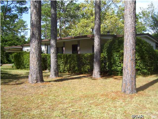 4BR 2BA Modular Home with carport. This home features a fireplace, screened in patio, fenced backyard and is on a large corner lot. No pets allowed !!!
