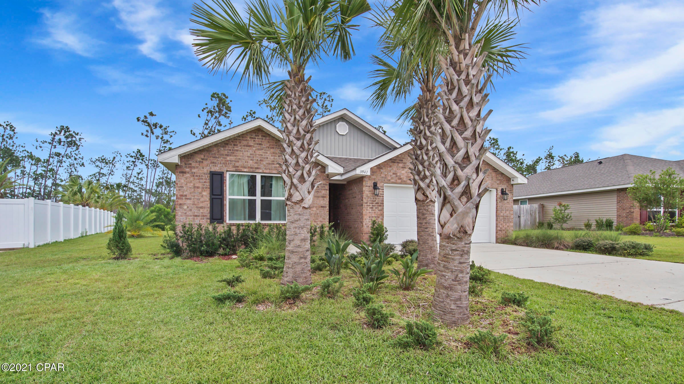 This move-in ready home is located in Magnolia Hills, where you'll enjoy sidewalks throughout the neighborhood, quick access to HWY 231, Tyndall AFB, NSA PC, and the beautiful beaches! This home features 4 bedrooms, 2 baths, and an open concept floor plan with split bedrooms, great for entertaining! The kitchen boasts ample counter and cabinet space a breakfast bar and pantry. Master bedroom is large and can accommodate a king size bed with additional furniture. The en suite has a double vanity, soaking tub, separate shower and a walk-in closet. The other 3 bedrooms are good size and share a hall bath. Other features include 8' ceilings, vinyl flooring in all main areas and carpet in bedrooms, lots of natural light, spacious laundry room, 2 car garage, and an expansive covered porch that allows you to enjoy the private backyard. Home is located in flood zone X.