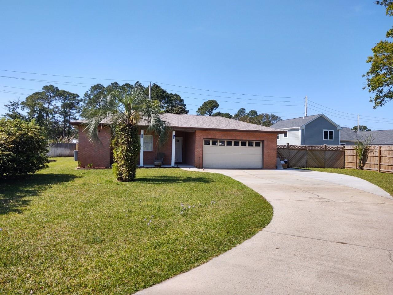 'CURRENTLY UNDER CONTRACT, SELLER ACCEPTING BACKUP OFFERS'  3 Bed/2 Full-Bath with a 2 car attached Garage, and a HUGE fully fenced yard! Master Bath has a Beautiful glassed in tile shower with a 2nd sink and a walk-in closet. Guest bath has been tiled with a jacuzzi tub. Separate laundry room with sink. Garage has fans and a 'Beach Sink'. 2 outside sheds, one with power (20x10), 2 RV Hook-ups! Roof 2020. 1,100 sq/ft patio wired for sound. Irrigation system in place. Septic w/ lift station ('09). Clean as a whistle with upgrades! Every room is wired for sound except kitchen and Dining, including patio and can be powered by an Ipod! Firepit/grill can be propane. Bicycle to the Beach, Restaurants and Entertainment! *If measurements important, please verif