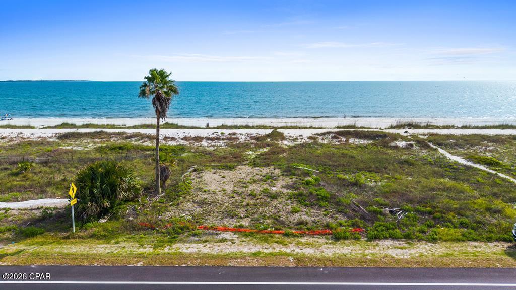 Imagine waking each morning to the sound of gentle waves and breathtaking views of the sparkling Gulf of America from this exceptional beachfront lot in beautiful Gulf County, Florida. Boasting pristine white sand beaches and gorgeous blue waters, this rare property offers the perfect setting to create your dream coastal retreat. Whether you envision a luxurious vacation home, a peaceful year-round residence, or a high-performing investment property, the possibilities are endless. Enjoy the tranquility of a quiet, uncrowded beach while remaining conveniently close to local shopping, dining, marinas, and outdoor recreation. Spend your days fishing, boating, shelling, or simply relaxing as spectacular sunsets paint the sky each evening. With direct access to one of Florida's most stunning stretches of coastline, this premier Gulf-front lot provides the ideal combination of natural beauty, privacy, and convenience--an extraordinary opportunity to own a piece of paradise and build the beach lifestyle you've always dreamed of. Country style living at the beach. No highrise condos to line the beaches. This property is on a dog friendly beach.
