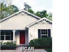 2005 built Lynn Haven home, located just off of 390 and 77. This 3 bedroom, 2 bath home has a large kitchen, with solid wood cabinets and a breakfast bar that opens up to the formal dining room. The screened in Florida room in back opens up to the patio inside the fenced backyard. The large backyard is landscaped and has a sprinkler system installed. All measurements are approximate; please measure if important.