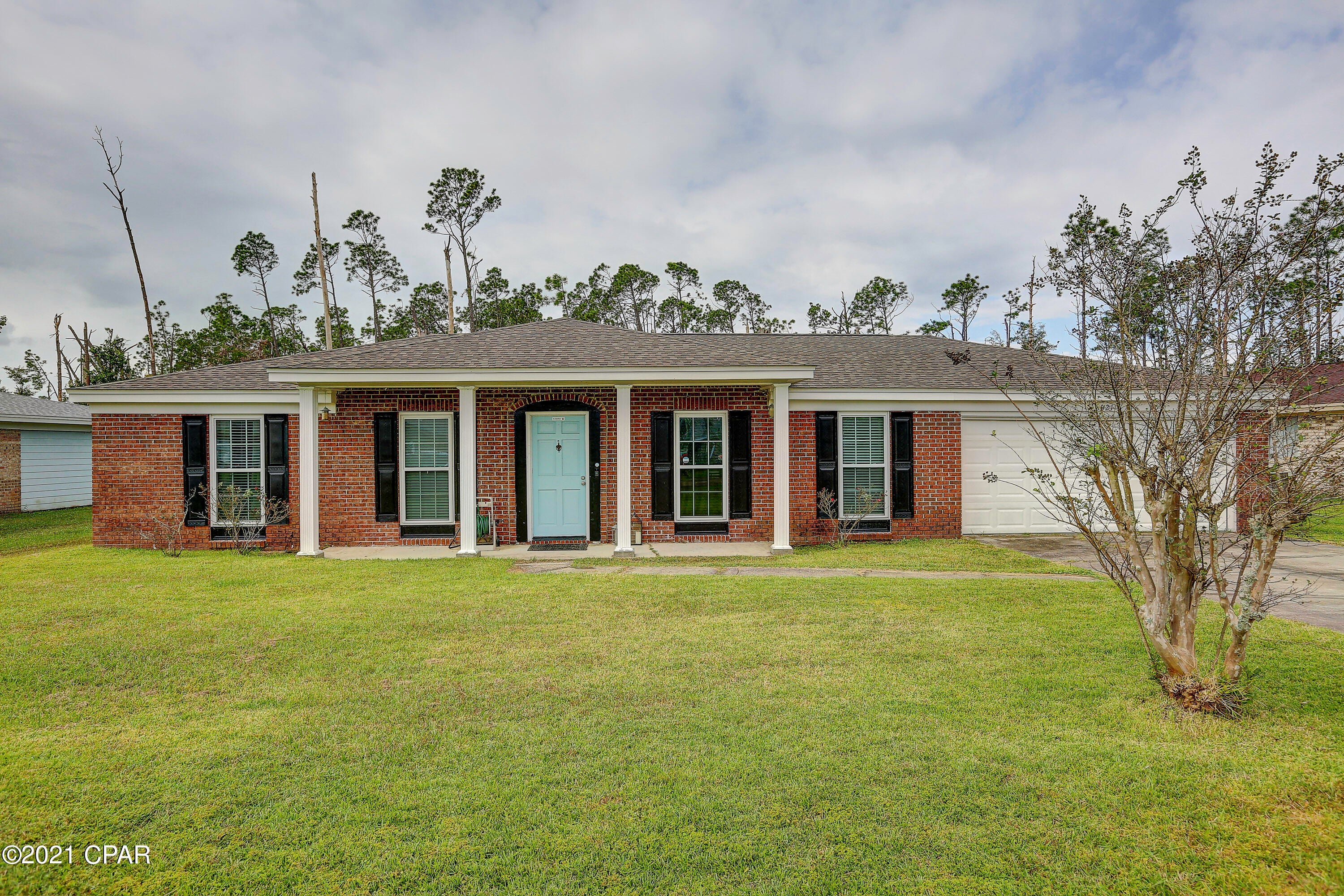 Call your favorite realtor today!!! You don't want to miss this adorable 3 bedroom 2 bath brick home in the heart of Panama City, in the quiet neighborhood of King Estates. Located both close to HWY 390 and just minutes away from 23rd Street shopping, health care, restaurants and more. Along with a spacious living room, this home features an extra large laundry room right off of the kitchen and 2 car garage..Perfect for a mud room,  extra storage, or even a place to keep those *not so pretty* dog kennels. Deep freezer, extra fridge/freezer combo, washer and dryer will convey! RING doorbell and RING security system also stay with home! The lot has a large back yard with a shed and direct line hook-ups for a gas grill.. talk about convenience!? (Window AC unit is not needed, just preferred) Buyer to verify all measurements if deemed important!!