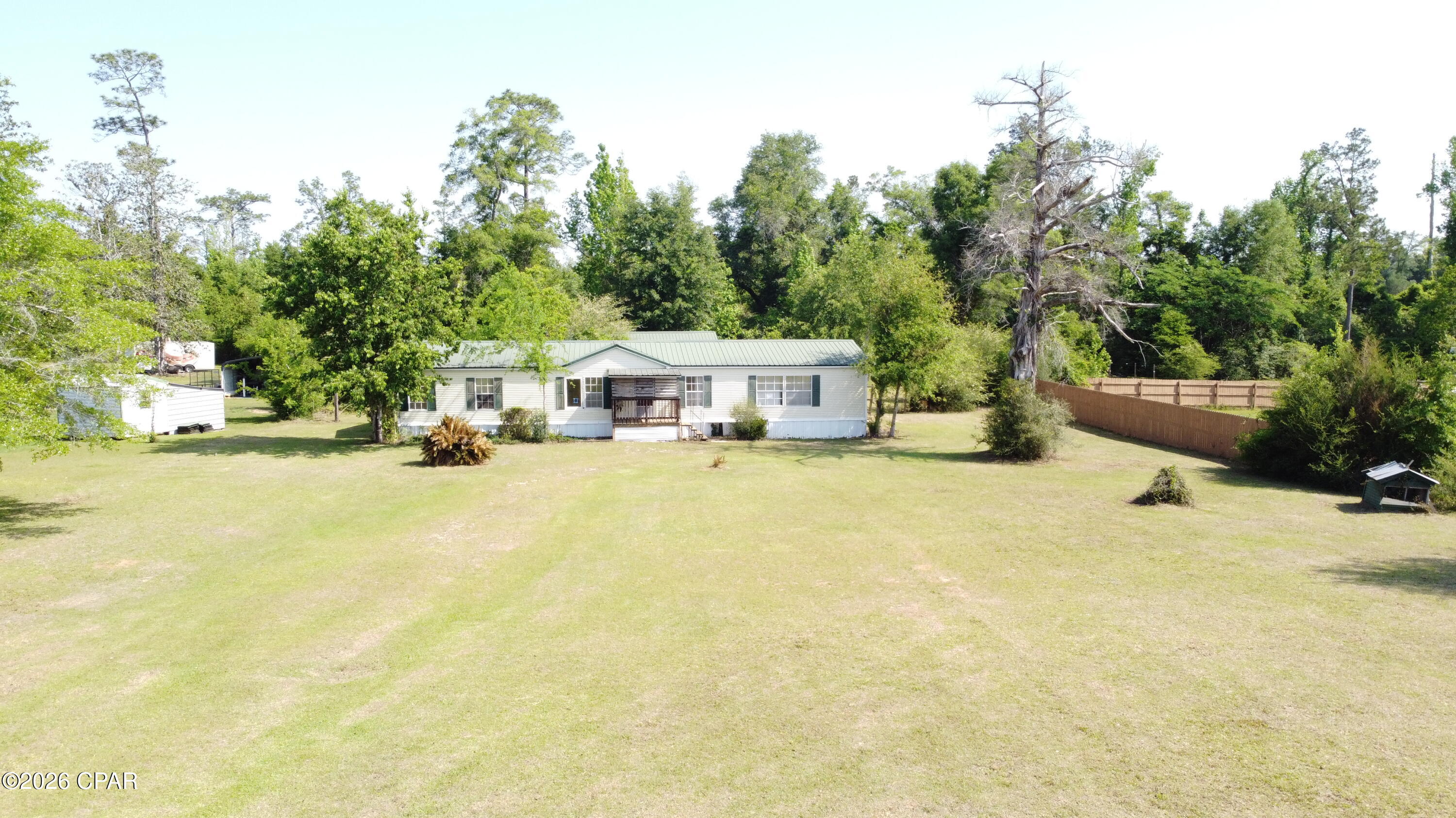 Fantastic opportunity to own at this location. Plenty of upside potential with this one. Over 1800 sqft on 1 acre. Also has a detached finished out building that would make a great office or music room. Home needs some repairs and updates but priced with plenty of room. Power is on and well works. Would make a great rehab to sell or long-term rental. Laminate floors in most of the home. Metal roof. Cash offers only due to repairs needed.