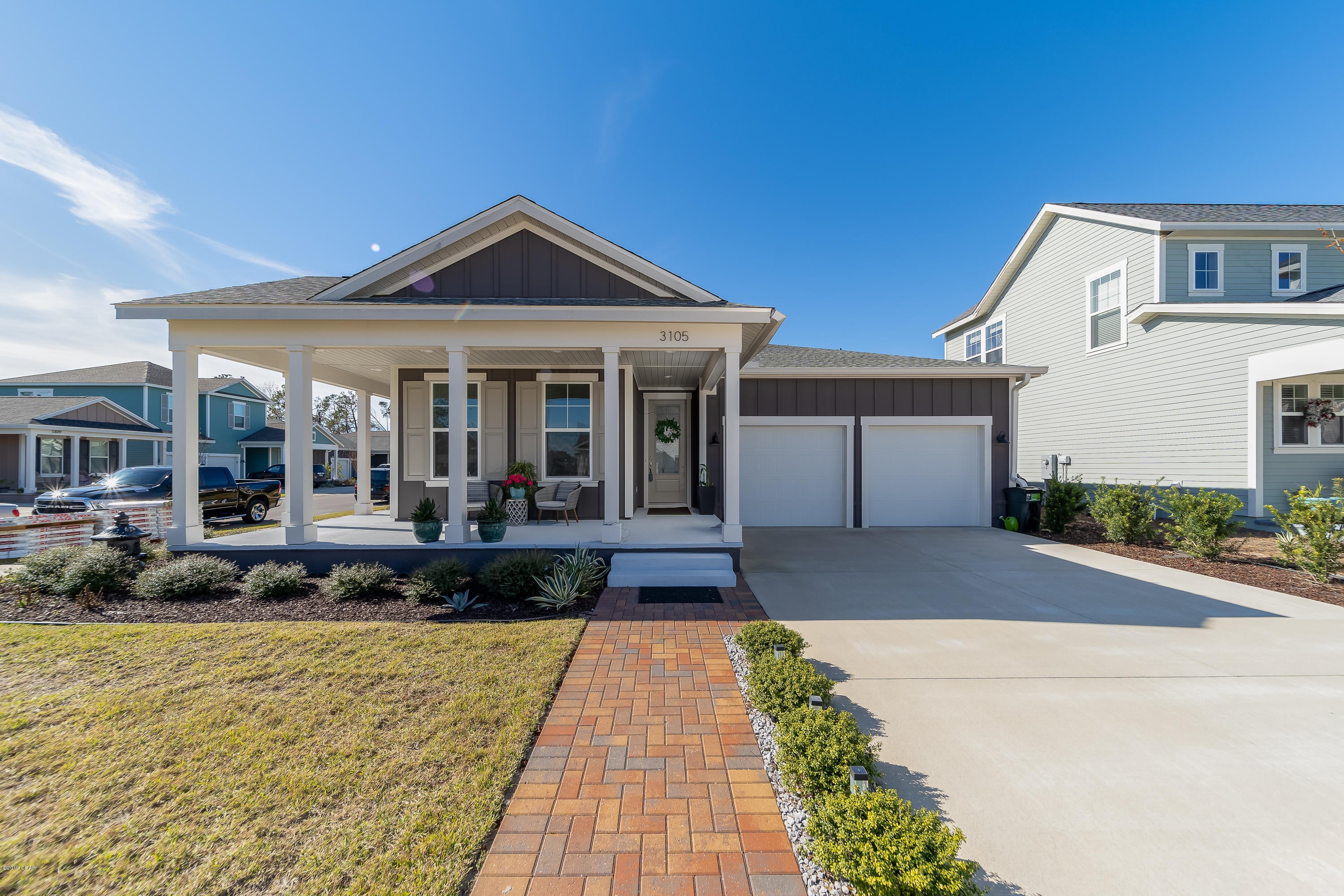 f you're looking for a home in SweetBay that you can move into right away, look no further...This Anna Maria floor plan with the coastal elevation , wrap around porch and on a corner lot is available for immediate occupancy. This is one of the most desirable floor plans with limited availability. From the time you enter the front door you can feel the amount of space this home has. This craftsman home has been upgraded with hardwood floors throughout, there is no carpet. The kitchen is open to the living room and dining area, which is great for entertaining or just watching a movie while making your favorite meal in your custom kitchen. The kitchen is truly a bakers delight with granite countertops,an oversized breakfast nook with pendant lights, recessed lighting, self-closing drawers, stainless steel appliances, a walk-in pantry, and plenty of cabinet space, and the sellers are leaving the refrigerator. The master bedroom is to the back of the home for added privacy and features a beautiful master bath, water closet, 6x3.5 walk-in tiled shower, garden tub,and a walk-in closet. The other two bedrooms are to the front of the home with their own private bath. The yard is professionally landscaped and maintained and also features an irrigation system. If you enjoy being outside and grilling, this is the perfect home for you with its 26.5x11 Lanai. Sit back with a nice glass of wine while grilling your favorite meal and take in the beautiful sunset or enjoy a fresh cup of coffee while taking in the morning fresh air. Additional Features include 2 car garage, alarm system, 8-ft doors, 9-ft ceilings throughout. With the new pricing structure, to recreate this home, it would easily cost well over 365k. If you have not been to SweetBay in a while it's definitely worth the drive out. This community is top of the line featuring Kestrel Park with a stunning community pool, grilling area, numerous lounging areas, a pool house, Basketball/Pickelball recreational area, Academy Square (Park/pavilion overlooking the water), Chickadee Park (playground/slides/park), Trail System (miles of beautiful jogging/walking scenery which extends to the bay), and many other parks plus community sidewalks. SweetBay also has a boathouse to launch canoes, kayaks, and paddle boards. University Academy is in the center of SweetBay and ranks top within the Bay County District. Samuel Taylor homes are some of the best constructed homes in Bay County and are build with 2x6 exterior studs vs 2x4's, allowing for a stronger home. In addition, R-19 in the walls is used vs. R-13, with R-38 in the ceilings vs. R-30, like many other builders. Most of the interior walls are insulated to help decrease noise levels. Because of how insulated these homes are, utility bills are significantly lower than the standard home.  Call today to setup a private showing before your dream of owning this wonderful home becomes someone else's reality. Age, Sq.Ft., Taxes, Room Dimensions or any important information is an estimate and must be verified by the buyer if important