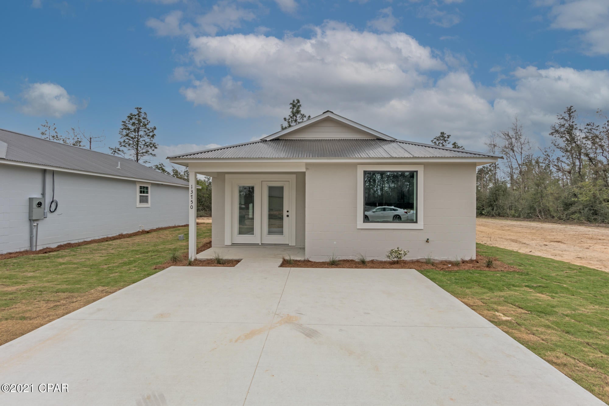 CURRENTLY UNDER CONTRACT, SELLER ACCEPTING BACKUP OFFERS. Brand New Home with no HOA. These are built to last. Concrete Block Construction, Metal Roof, Secondary Water Barrier, Low-E Windows, 17 Seer HVAC System. Open Concept Living Area, Covered Front Porch, New Septic. Well water. Low Maintenance and stylish concrete floors, new appliances, Formica countertops, laundry/utility room, and more! Quiet area North of Panama City near Hwy 231 and Hwy 20. 30 Minutes to Panama City, 40 Minutes to Panama City Beach. 1 Year Builder Warranty on home. County maintained roads.  Construction generally takes up to 4 months. Pictures and video are of similar floorplan but colors and finishes may change. All sizes, dimensions, plans, etc are subject to change, to be verified by buyer.