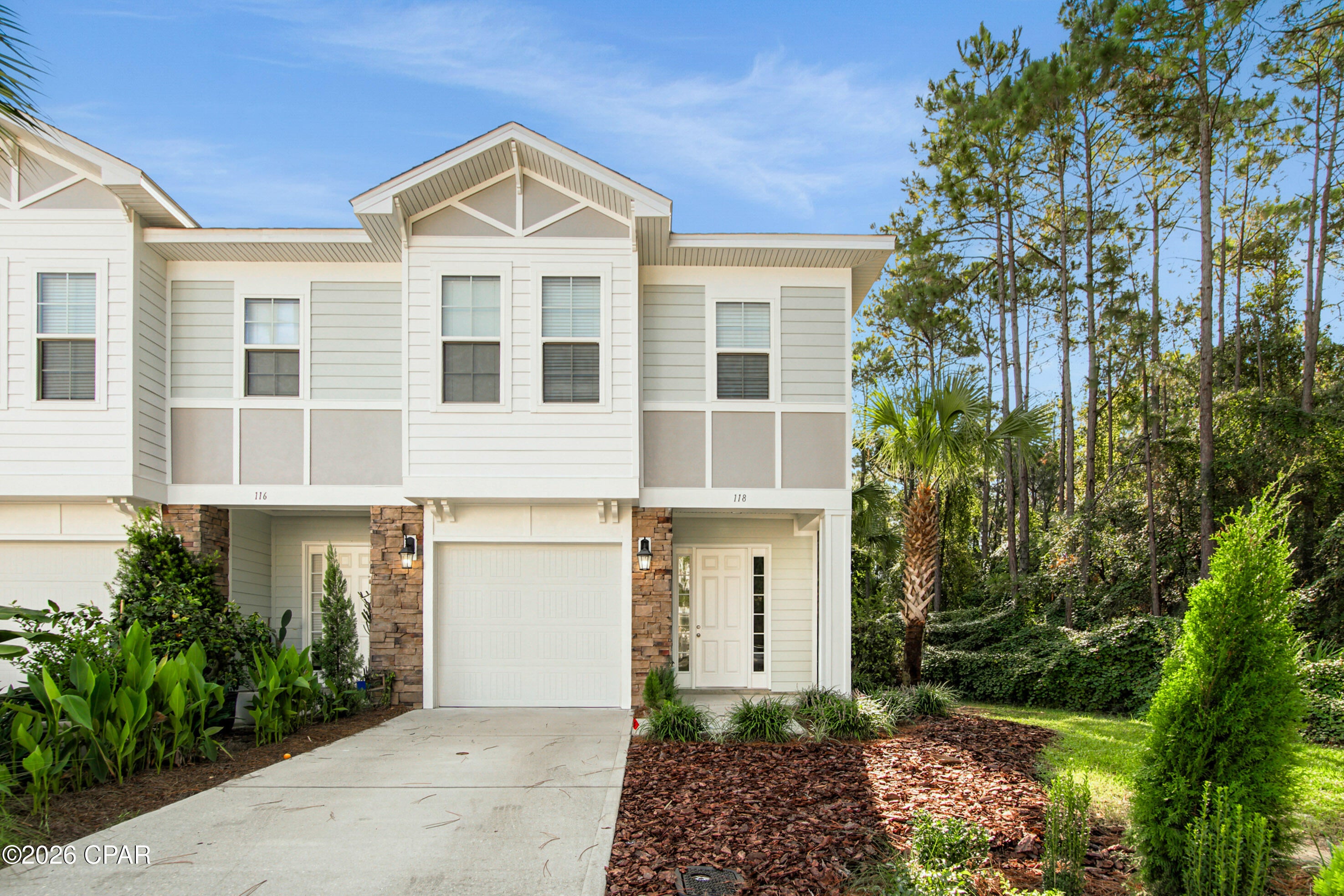 Welcome to this beautifully maintained corner-unit townhome located in the desirable Waterfall community at 118 Enchantment Falls Ln. This unfurnished 3-bedroom, 2.5-bath home offers 2,041 sq. ft., a 1-car garage, and 2 additional parking spaces. The first floor features vinyl plank flooring, while the second floor offers wall-to-wall carpet. Enjoy a private backyard with no rear neighbors, backing up to a wooded preserved area. Residents also have access to the community pool. Ideally located in Panama City Beach, the home offers convenient access to the beach, shopping, dining, and entertainment. Approximately 1.3 miles to Shoppes at Edgewater, 1.4 miles to The Shoppes at Lyndell Centre, and 1.5 miles to Breakfast Point Marketplace. Nearby schools include Hutchison Beach Elementary, Surfside Middle, and J.R. Arnold High School. Applicants must have verifiable gross monthly income of at least 3 times the monthly rent.