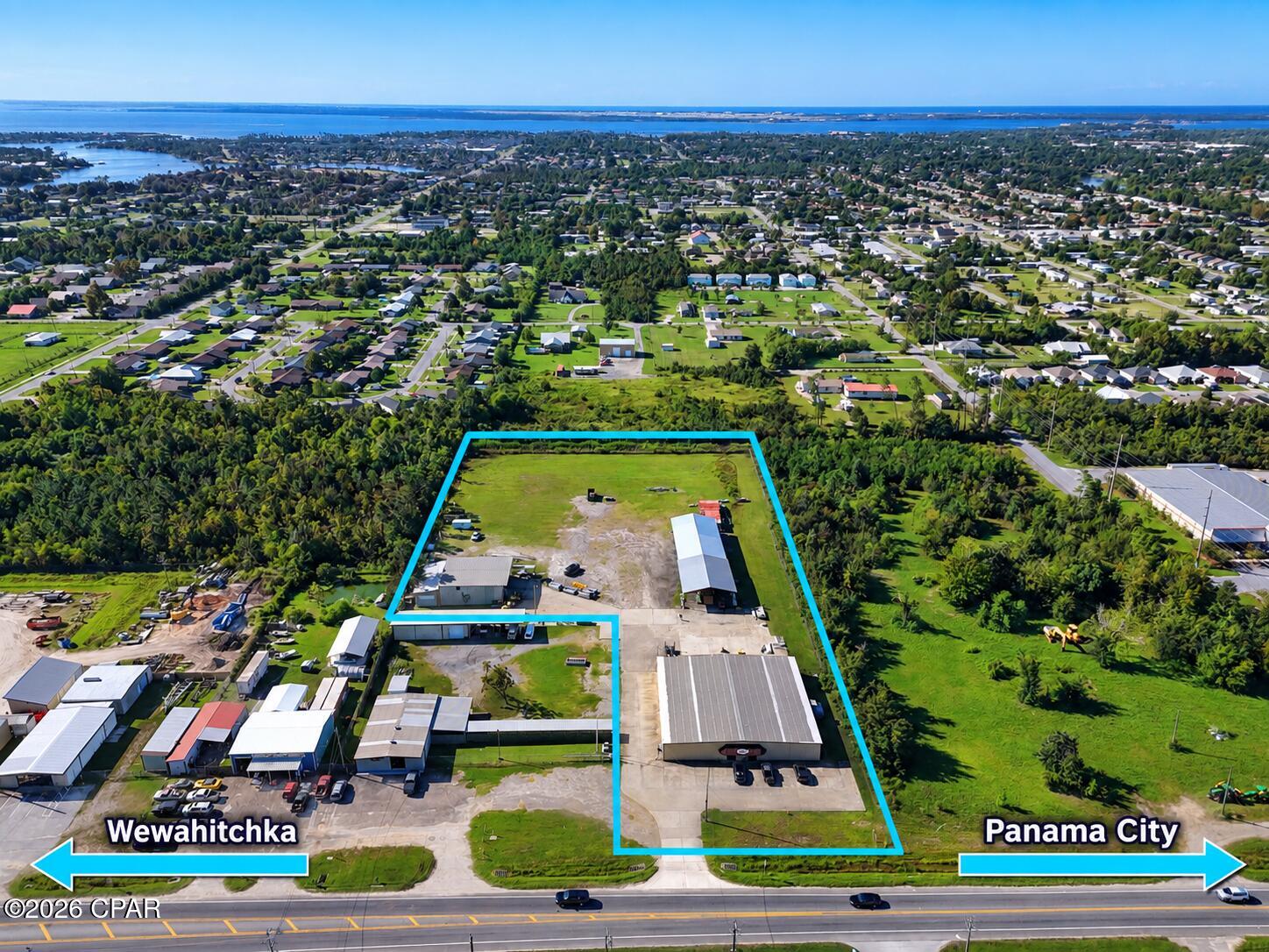 This expansive 4.2-acre commercial property offers a versatile industrial footprint perfectly suited for manufacturing, distribution, or heavy equipment operations. The fully secured site is enclosed by a 6-foot chain-link fence topped with 3-strand barbed wire and features extensive concrete and crushed asphalt yards for optimal staging, parking, and logistics. The site plan also strategically incorporates dedicated grass and retention areas. The complex consists of three primary structures designed to accommodate a wide range of operational needs:

Main Heated & Cooled Building (100' x 100' x 14'): This 10,000 sq. ft. metal building serves as the central professional hub. It features an extensive, fully climate-controlled build-out including a foyer, eight standard offices, a dedicated production office with an en-suite bathroom, an engineering room, and a break room. The facility also houses an HVAC room, a router room, power panels, and two additional primary bathrooms.  

Secondary Metal Warehouse (50' x 75' x 20'): A versatile 3,750 sq. ft. 20 Ft high-clearance metal building. This structure is optimized for large equipment or shipping/receiving with two 12' x 12' roll-up doors and one massive 18' x 18' roll-up door.  

Heavy-Duty Pole Barn (40' x 150'): Providing 6,000 sq. ft. of covered, open-air storage, this space is ideal for fleet parking, staging raw materials, or protecting heavy machinery.