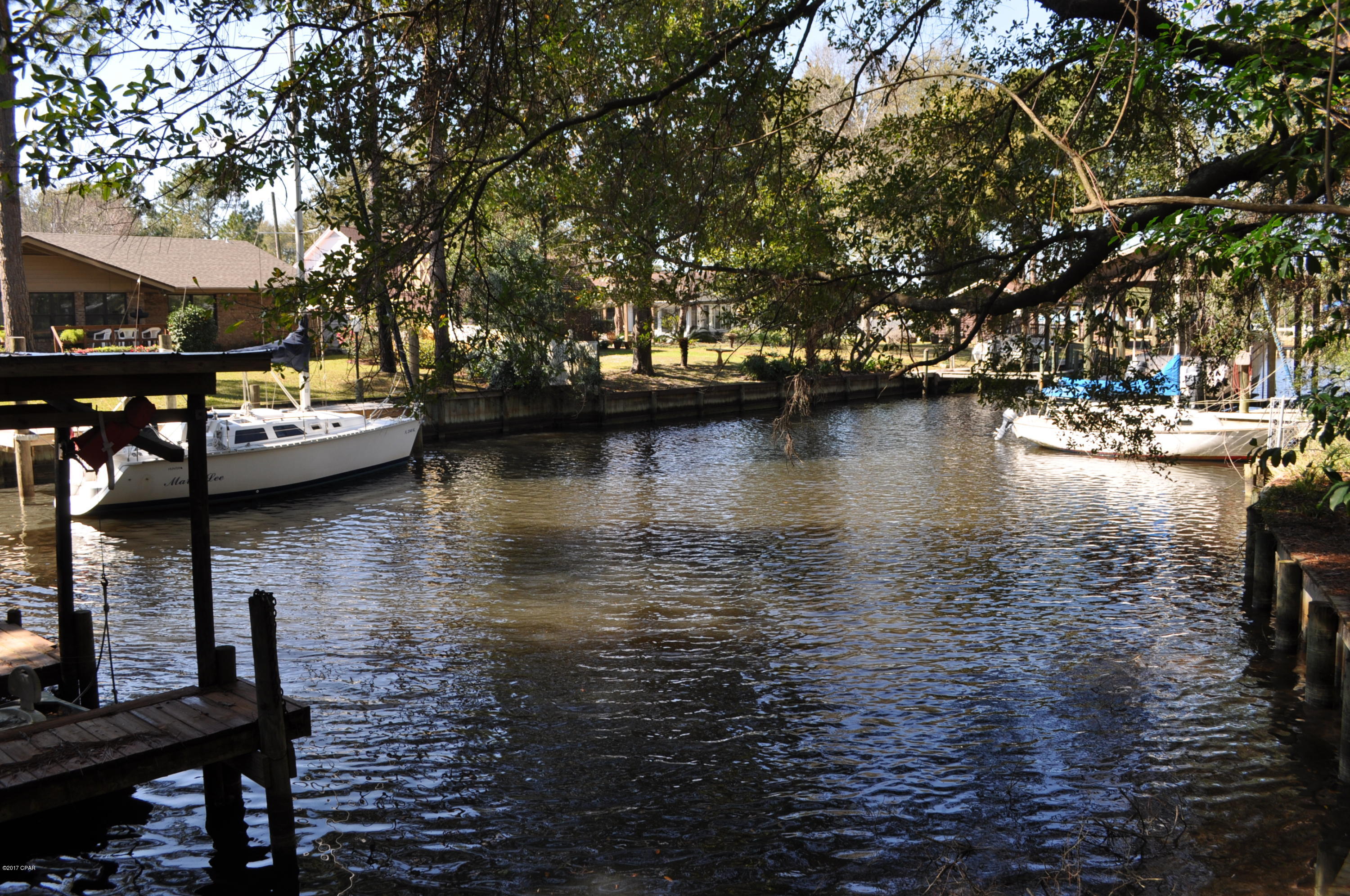 Canal front lot in Woodlawn with access to St. Andrews Bay and the Gulf of Mexico! This is a great building lot, recently surveyed with approx. 90' on the canal. Woodlawn is one of Panama City Beach's most established neighborhoods and you're only 5 minutes from the Navy base, shopping and the beach! This is a great opportunity to build your dream home on a deep water canal! All info is approx. and must be verified by Buyers if important.