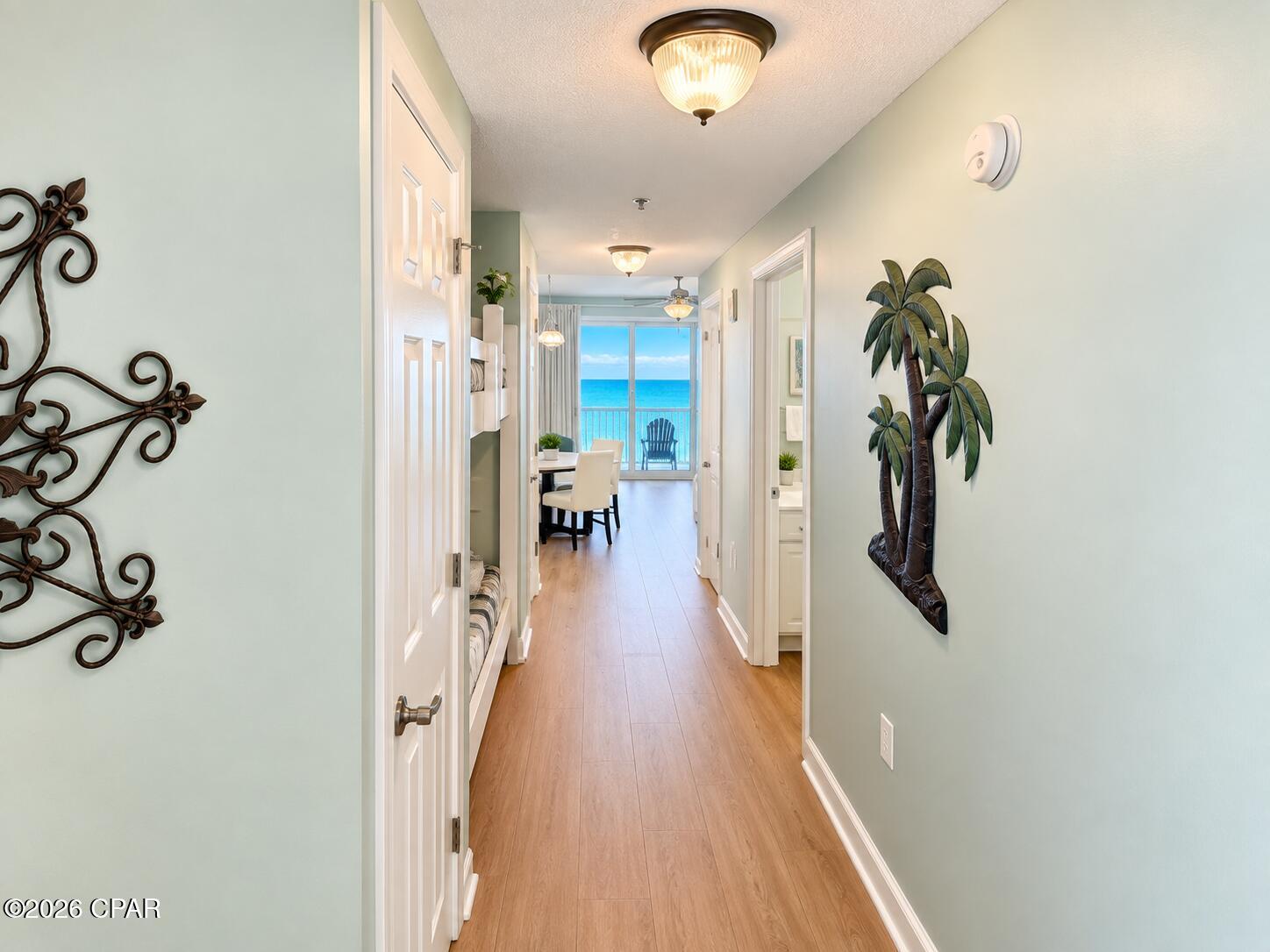 Welcome to Seychelles 903, an immaculate turnkey 1-bedroom, 2-bath luxury condo on the quieter east end,  giving you a front-row seat to 200 feet of pristine white sand and the emerald Gulf waters.  This newly updated condo comfortably sleeps 6, contains recently upgraded furniture, updated bedroom set, HVAC installed in 2020, hot water tank installed in 2022, and new Stationmaster LVP throughout installed 9/1/2026.  Adding even more value, quarterly HOA dues cover all major utilities, including electricity, water, cable, and WiFi, helping simplify ownership costs. Located within the amenity-rich Seychelles Beach Resort, owners and guests enjoy two Gulf-front pools, a hot tub, fitness center, conference room, covered parking garage with convenient walkover access, optional onsite rental management, and onsite maintenance and security personnel.  Located just steps from Schooners and minutes from St. Andrews State Park, golf, marinas, shopping, dining, and entertainment, this condo is perfectly positioned for both relaxation and adventure.  The resort has a  strong reputation with return visitors, and this particular unit comes with a database of direct renters accrued over the years.  All future bookings convey as this unit is privately managed.