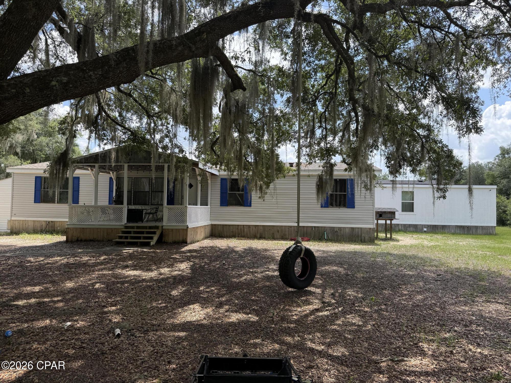 Discover the endless possibilities with this exceptional property featuring three separate dwellings situated on 10 beautiful wooded acres in a peaceful country setting. Ideal for multi-generational living, rental income, or guest accommodations, this unique property offers privacy, versatility, and plenty of room to grow.

The main residence features 3 bedrooms, 2 bathrooms, and a flexible bonus room that can easily serve as a 4th bedroom, home office, or hobby room. Recent updates include a newer HVAC system and newer hot water heater, both approximately 4 years old, providing added comfort and peace of mind.

Guest Unit A, just 3 years old, offers approximately 980 square feet with 2 bedrooms, 1.5 bathrooms, a laundry room, a walk-in closet, and the potential to add a kitchenette. Built with quality in mind, it features durable 2x6 exterior walls, R-19 insulation, and its own 40-gallon hot water heater.

Guest Unit B, also just 3 years old, offers approximately 700 square feet with 1 bedroom, 1 bathroom, a walk-in closet, a laundry room, and the potential to add a kitchenette. Like Guest Unit A, it is constructed with 2x6 exterior walls, R-19 insulation, and includes its own 40-gallon hot water heater.

Additional improvements include a utility shed complete with electricity, heating, and air conditioning, a new septic system, a new well pump, and a 20-foot Conex storage container for extra storage. The expansive wooded acreage provides exceptional privacy, abundant wildlife, recreational opportunities, and ample space for future expansion.

Whether you're searching for a family compound, an investment opportunity, or a private country retreat, this one-of-a-kind property offers incredible flexibility and value. A must-see to truly appreciate everything it has to offer. Schedule your private showing today!