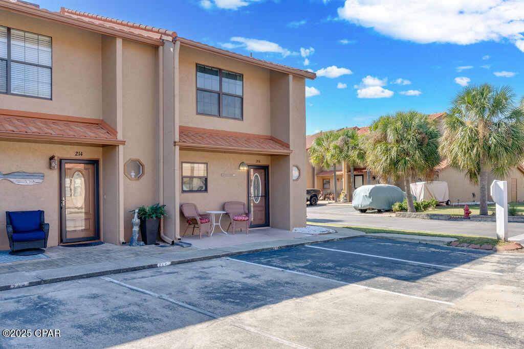 Large END unit in Gulf Highlands Beach Resort with no elevators or long walks to the Beach and comes fully furnished. This unit has 2 privately owned parking spaces just steps from your front door and a golf cart approved parking pad. You'll find this Updated 2 Bedroom townhome has 2.5 Baths and is large enough for everyone to hang out and enjoy the comforts of a home away from home. The kitchen shines with White cabinets and granite counter tops. Upstairs there are 2 very comfortable bedrooms with private bathrooms, TVs, and large closets. The back patio is set up with table, chairs & gas grill. Updates include, paint, lighting, LVP flooring upstairs, microwave, dishwasher, washer & dryer to name a few. The Roof is about 3 yrs. old, HVAC and water heater were replaced last year.  There are 11 pools in Gulf Highlands, 5 are heated and one pool is beach FRONT with a beach house restaurant. 3 tennis courts / 4 pickleball courts, 2 lighted tennis courts, fitness center, 18 hole mini golf, 2 playgrounds, shuffleboard courts, conference center. this GATED RESORT is centrally located with several attractions, dining, shopping, post office, and Walmart just minutes away. HOA fees are $1090.14/Qtr. and include household trash disposal, internet, lawn mowing, sprinklers, pest control, termite contract with HOA. Great for weekly and/or long-term rentals.