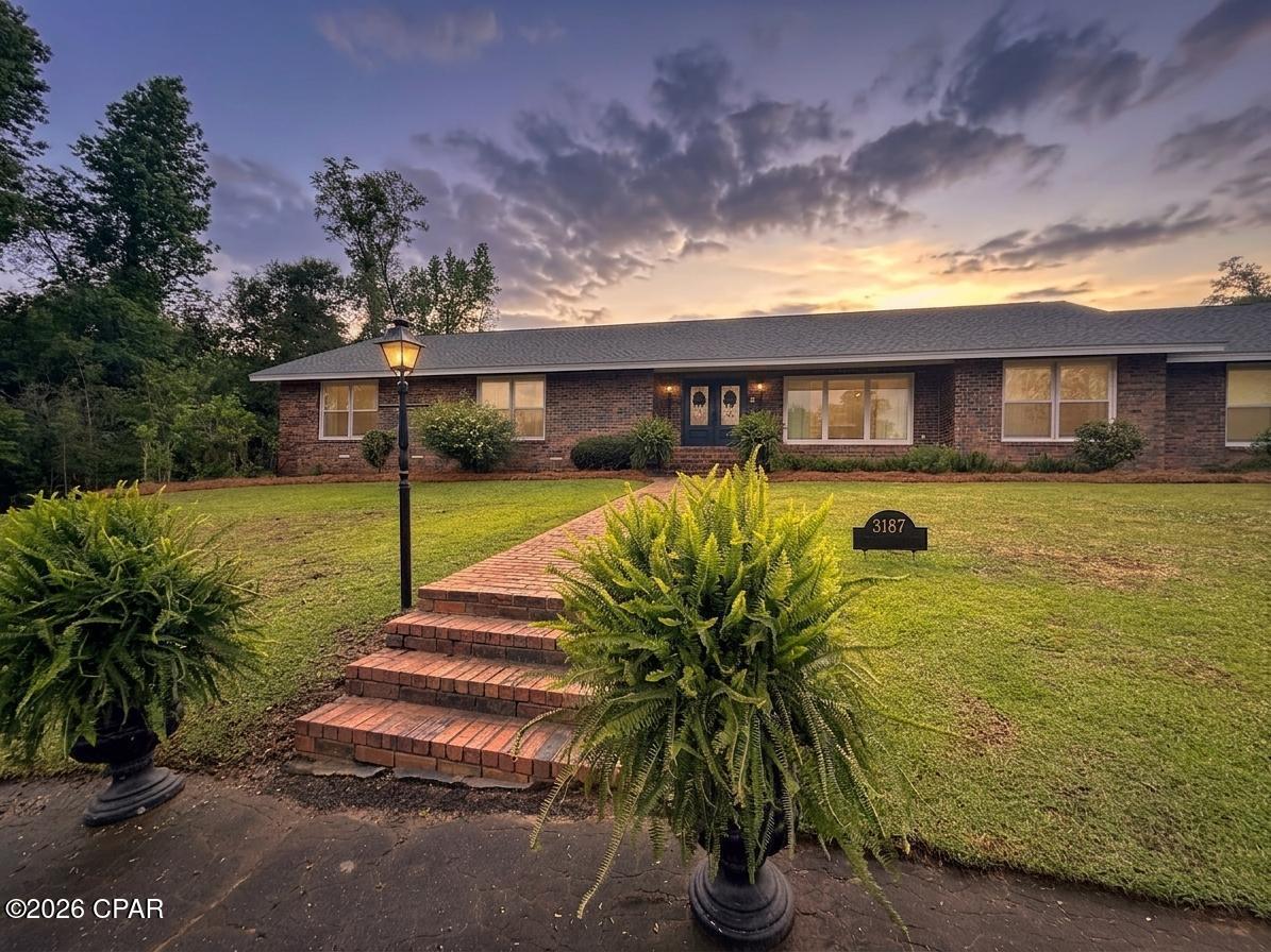 Welcome to your private oasis in the heart of town--this beautifully updated 4-bedroom, 3.5-bath home offers space, charm, and incredible versatility on a meticulously maintained 1.34-acre lot. With lush landscaping that bursts to life in every season--magnolias, bridal wreath, hydrangeas, ferns, and Peggy Martin roses all blooming in harmony--this property delivers a setting that photos simply can't capture.

A circular drive provides a warm and inviting arrival, setting the tone for what awaits inside. Step through the front door and instantly feel at home in the spacious living room, where warm wood flooring and a striking fireplace create the perfect gathering space.  Great room for entertaining!  The adjacent eat-in chef's kitchen features a beautiful antique island, ideal for both everyday living and entertaining, with a formal dining room ready for hosting special occasions.

One of the home's most flexible and exciting features is the bonus flex room--complete with its own walk-in closet, half bath, and access to a dedicated ''Christmas Closet.'' Whether you envision a 5th bedroom, home gym, Mother-in-law suite, playroom, or homeschool space, this area adapts to your needs with ease.  

Outdoor living is just as impressive, with a massive screened porch that offers endless possibilities, including a water hookup for a future outdoor kitchen. A charming courtyard enhances the sense of privacy, framed by meticulously trimmed and blooming ligustrum for a serene, scenic escape.  The back yard is fenced. 

Storage is truly unmatched throughout the home, highlighted by the primary suite, which includes not one but two walk-in closets plus a dedicated bill-pay or sewing nook--an unexpected and thoughtful touch.

This home is more than just a place to live--it's a lifestyle defined by comfort, beauty, and room to grow.