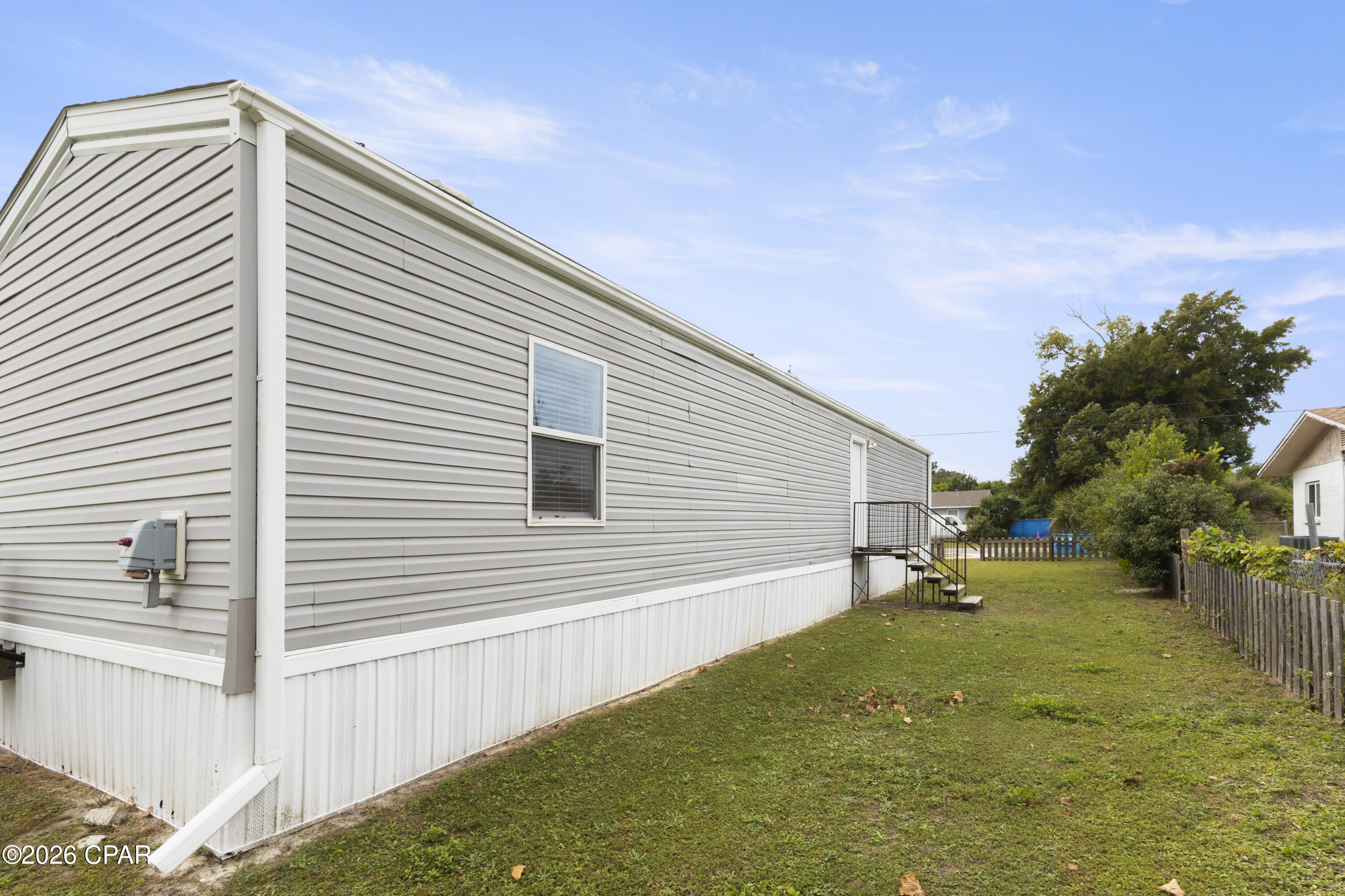 Recently Remodeled Mobile Home featuring LVP flooring, quartz countertops, recently installed kitchen cabinets and bathroom vanities.