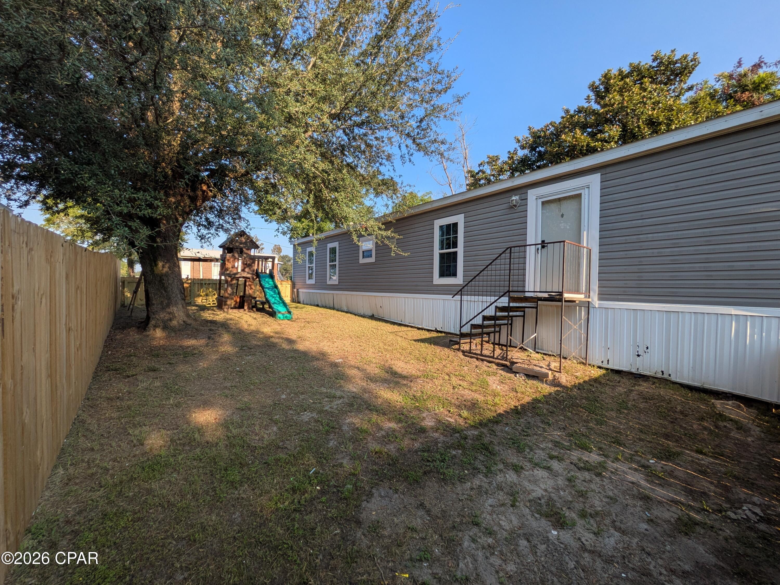 Cozy spot with several shaded trees and fenced yard. This 2020 model is ready for it's new owners. Updated Kitchen with new cabinets, stove, sink and countertops. Fresh paint and carpet throughout for comfortable living. 

Located near stores, parks, schools, public boat launches and more. Plenty of room to park vehicles, boat, etc. 5 Minutes to all new Parker Sports Complex, an 18 acre park with baseball fields, basketball, tennis, walking trail, dog park, restrooms, and playground. 

Mature  beautiful magnolia and oak trees for shade, and plenty of outdoor space with over a quarter acre lot.

City water & sewer, no flood insurance needed, and No HOA!

Make your appointment to see it today!