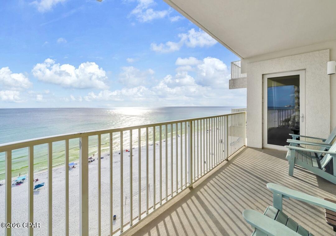 RARE GULF-FRONT CORNER UNIT WITH AN OVERSIZED WRAPAROUND BALCONY, RESERVED PARKING SPOT + OWNER FINANCING AVAILABLE AT 2.9% INTEREST RATE!

Opportunities like this rarely come available at Shores of Panama. This spectacular Gulf-front corner residence features one of the most sought-after floor plans in the entire resort, highlighted by an enormous wraparound balcony that delivers breathtaking panoramic views of the emerald-green Gulf waters, sugar-white beaches, and the resort's world-famous lagoon-style pool. Unlike standard balconies, this expansive outdoor living space provides multiple seating areas, incredible sunset views, and a front-row seat to everything that makes Panama City Beach one of the Gulf Coast's most desirable destinations.

Inside, floor-to-ceiling glass fills the residence with natural light while showcasing stunning water views from nearly every angle. The spacious 2-bedroom plus bunk room, 2.5-bath layout sleeps just like a 3 bedroom and comfortably accommodates family and guests while offering exceptional flexibility and rental appeal.

The beautifully appointed kitchen is designed for entertaining, featuring granite countertops, white shaker cabinetry, stainless steel appliances, and abundant workspace for hosting unforgettable beach gatherings. The open-concept living area is enhanced by upscale designer furnishings, custom tile flooring throughout, and absolutely no carpet, creating a sophisticated coastal atmosphere that is both elegant and easy to maintain.

Wake up each morning to Gulf views from the luxurious beachfront primary suite, complete with private balcony access and a spacious ensuite bath. Additional guest accommodations include a generously sized guest bedroom and dedicated bunk room, making this residence ideal for large families and vacationing guests.

Adding even more value, this residence includes a dedicated parking space located directly outside the unit on the same floor--a rare convenience that allows you to walk straight from your vehicle to your front door without ever waiting on an elevator.

Shores of Panama continues to be one of Panama City Beach's premier resort destinations, featuring Florida's largest lagoon-style pool, an expansive tropical pool deck, beachside hot tubs, indoor heated pool, sauna, steam room, fitness center, spa services, on-site dining, and direct beach access. You're also just minutes from Pier Park, waterfront dining, entertainment venues, and the brand-new Topgolf attraction.

For buyers looking to maximize affordability, the seller is offering a special financing opportunity, creating an incredible chance to own one of the most desirable Gulf-front corner units in Panama City Beach.

Whether you're searching for a luxury beachfront getaway, an income-producing vacation property, or both, this extraordinary residence delivers the views, amenities, location, and lifestyle that buyers dream about.

Rare wraparound balcony. Gulf-front corner location. Same-floor parking. Owner financing available. This is the one buyers wait for.
