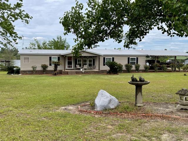Beautiful Jacobsen waterfront home on Lake Highlands.  You have over 300' on the lake with a dock.The home has extra nice features including fireplace in the living room that is wired for surround sound, large master bedroom with master bathroom with garden tub, walk through closets and a separate shower. The nice kitchen has all appliances.  There is underground electric from the yard. All new windows.The washer and dryer remains. All window coverings stay..   There is a 4 car attached carport and you have a 5 bay open pole barn and 2 metal buildings; it is chain link fenced and has an electric entry gate. All 3 TVs stay.  The porch furniture and the lawnmower remains .  Nice landscaping and has paved driveway.
