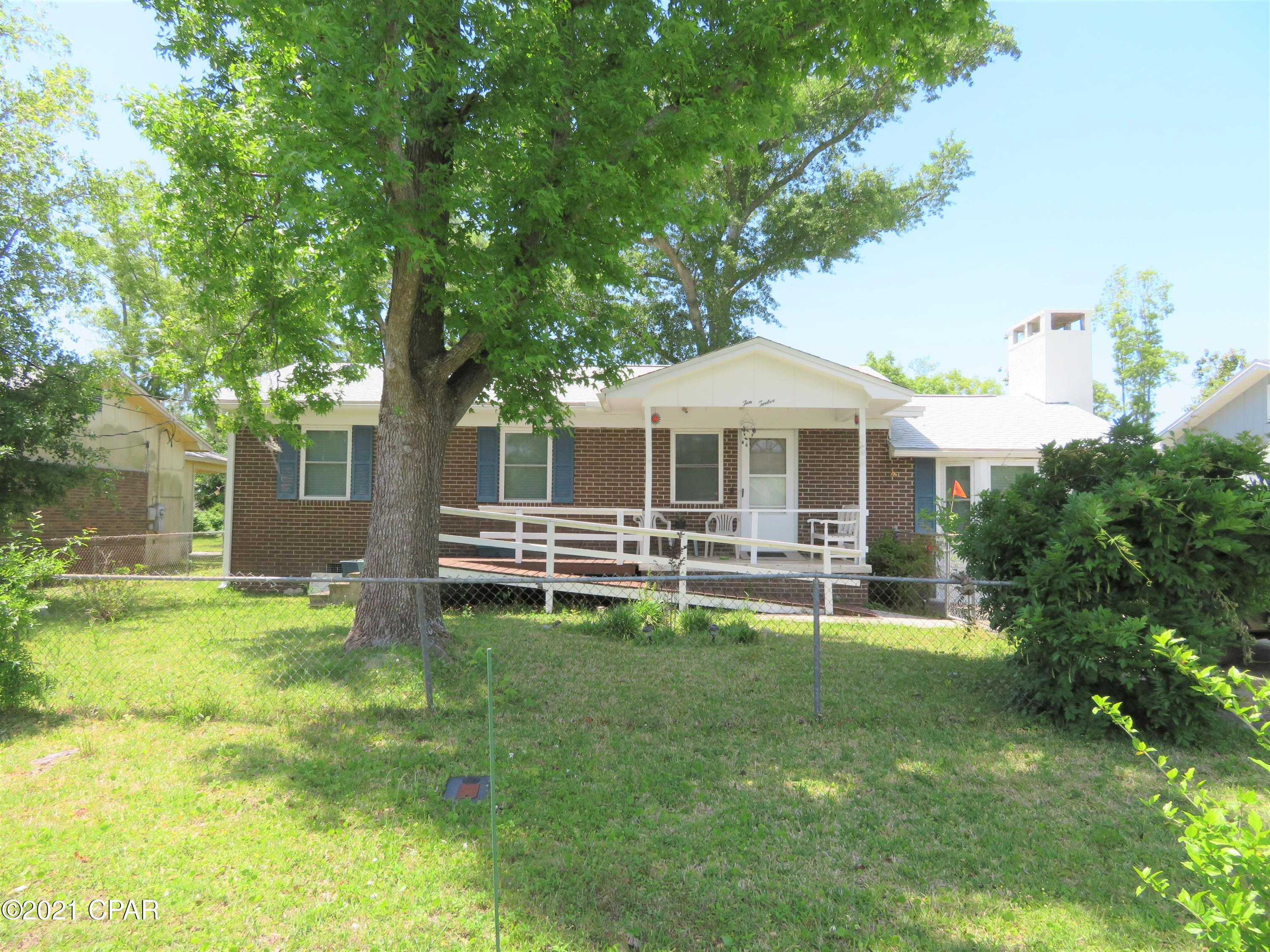 What an opportunity!  Two homes for the price of one!  Live in one and rent the other to help make the mortgage.  Or use one as a Mother-in-Law Quarters or guest house.  The main home has 3 bedrooms and 2 bathrooms with a large sunken great room with a fireplace.  The kitchen and dining area are open to the great room with built in shelving for storage.   One of the bathrooms has even had a walk in tub installed. The guest house has 2 bedrooms and bathroom and a full kitchen and living room.  Seller previously rented this for $1,000 a month.  The yard is fenced for pets.  Both homes have new roofs.  The main home had new windows installed a couple of years ago. The home is sold As Is and would be super cute with some TLC.  Seller will provide a $5K credit towards painting or updates!