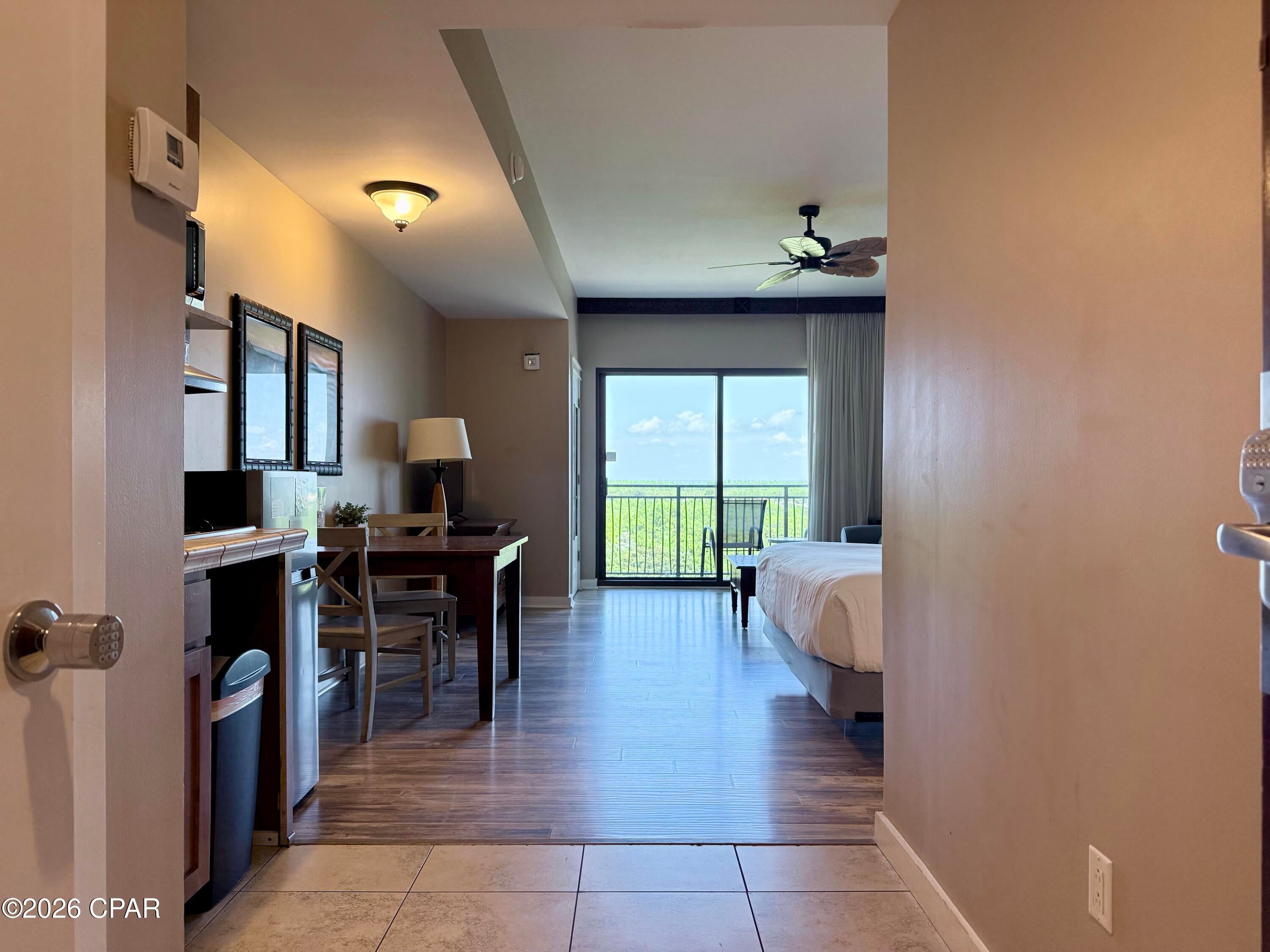 Great opportunity to own a short-term rental in Origin!  Origin 913 is being offered fully furnished and rental ready!  With a total of 465 square feet, there is plenty of comfortable space for up to 4 guests.  The combined living and sleeping area has a king sized bed, as well as, a queen sized sleeper sofa.  The kitchenette has an upgraded larger fridge, 2 burner cooktop, and a microwave.  The full bath has a tiled tub/shower combo, and ceramic tile floors.  There is also NO CAPRET throughout!  The nature view from the balcony is lush, and makes a quiet, peaceful place to enjoy some fresh air with views of Pier Park, the Skywheel, Top Gulf, and even a peek a boo view of the beach and Gulf to the west.  Located across the street from Sharky's beachfront restaurant and bar, and within walking distance to Pier Park, Top Gulf, and a multitude of dining and entertainment options.  In the middle of all PCB has to offer, walkable to all the fun activities, and only minutes from the sugar sands and emerald waters through the deeded access, Origin 913 has everything you'll want and need!

Origin offers many amenities including two BBQ grill/picnic areas, a heated pool, hot tub, theater, game room, laundry facility, vending, a gated community with 24 hour security, and retail on site including the Beaches and Cream convenient store and grill, and Sunsations beach store.  Origin is also one of the only high rise condos in PCB to offer enclosed corridors to keep you dry, warm, and secure!  Call me today to schedule your chance to see this one in person!
