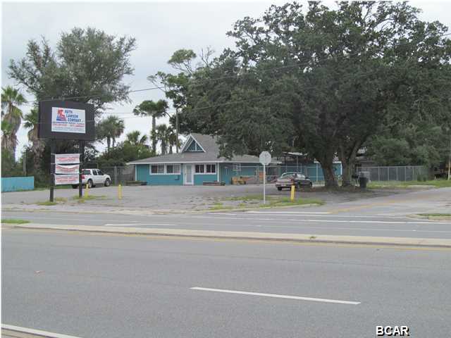 PRICE REDUCED from $149,000! Great commercial corner site located at the foot of the Dupont Bridge (Tyndall Bridge)in Parker. Site offers a 1,518 SF building, a wood outbuilding with carport, and a fenced yard area in the rear. Site offers great visibility, high traffic counts and two road access with median cut on Highway 98. The building is currently tenant occupied and utilized as an office by a service contractor which remodeled the interior into an office area. Tenant can stay or will relocate with 90 day notice to vacate. This location was formerly Maxies Drive-In Restaurant, then a fish market. Great visibility, easy access and high traffic counts at the gateway to Panama City & Tyndall Air Force Base home of the F-22 Raptor, the 325th Fighter Wing and 1st Air Force.