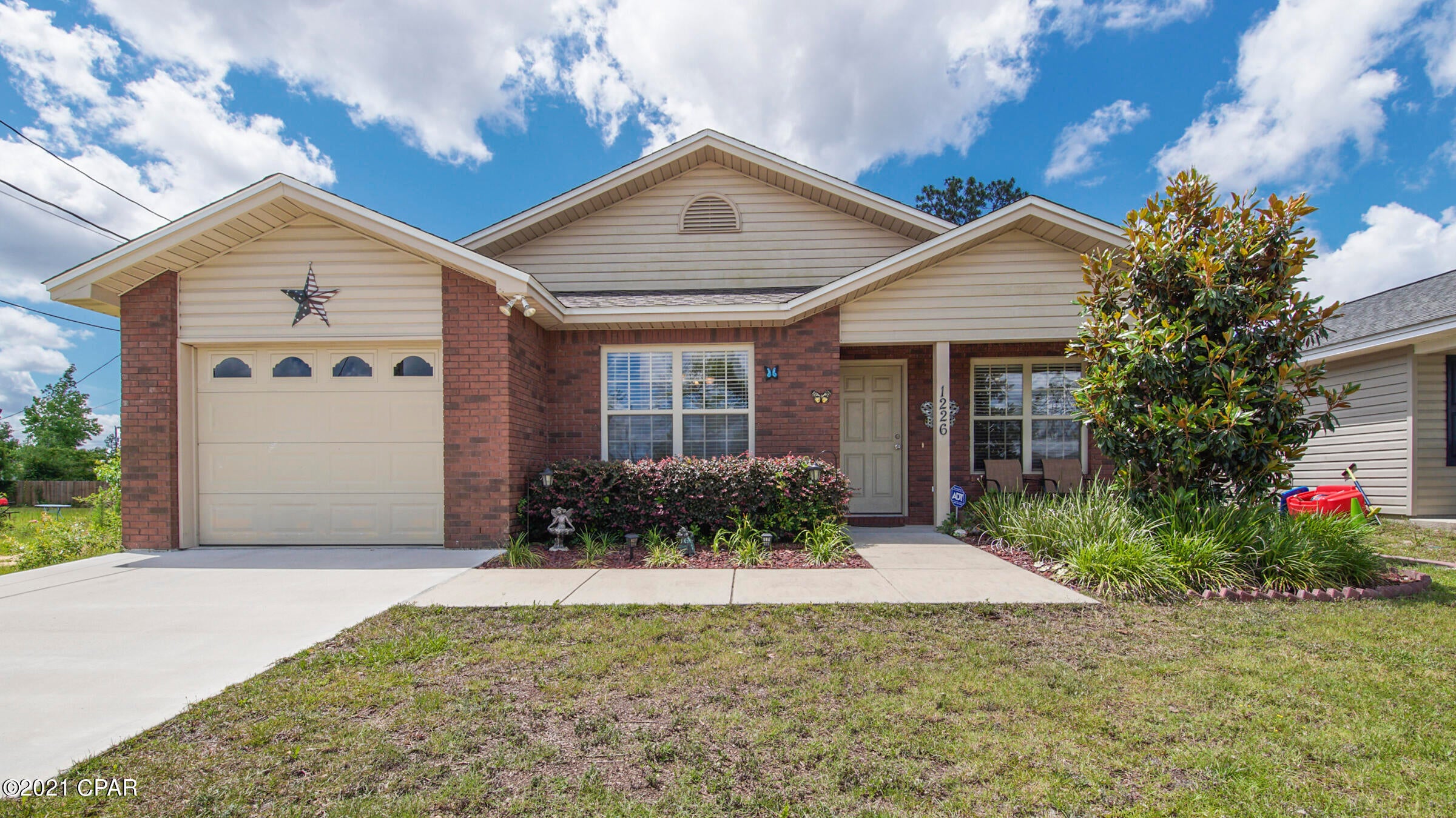 CURRENTLY UNDER CONTRACT, SELLER ACCEPTING BACKUP OFFERS  Country quiet but just minutes to town!  This lovely, well kept and beautifully landscaped one owner home is less than 5 miles to Lynn Haven's shopping and restaurants and less than 30 minutes to Tyndall AFB and Naval Coastal Systems.   Inside details include crown molding, tray ceilings, chair railing and oversized windows in living/dining area for lots of Florida sunshine natural lighting.  Galley kitchen means everything is easily accessible with ample storage space and an ''all gather around'' good size breakfast bar!  Home is all electric with new roof in 2018, sprinkler system, outdoor storage shed and some new privacy fencing.  Two covered porches  - one out front to enjoy the lovely flowers in your front yard  or the very p This home is close to fishing spots, schools, and several parks including parks with public boat ramps.
This home isn't going to last so call your REALTOR today to schedule your own private showing before it's gone!