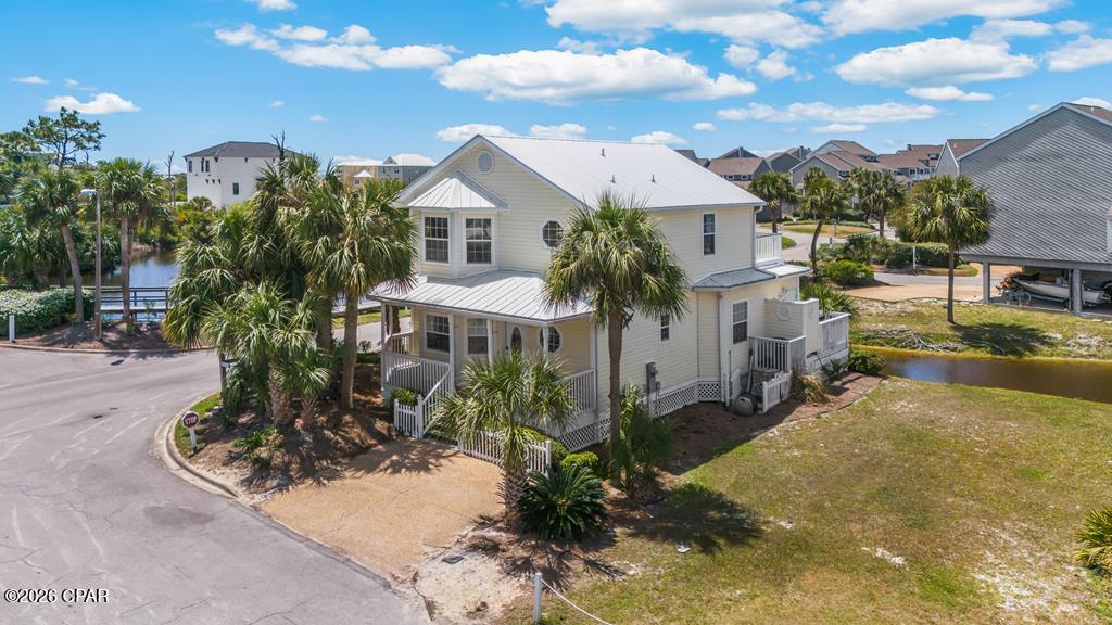 COASTAL 2-STORY BEACH COTTAGE overlooking the pond in Barrier Dunes community on North Cape San Blas. Perfectly positioned just a short walk away from the entrance to St. Joseph Peninsula State Park, this home offers effortless access to miles of unspoiled shoreline, natural beauty, and one of Florida's most pristine beaches. This fully furnished, turnkey property truly stands apart. As a detached single-family home rather than a duplex or townhome, it provides enhanced privacy along with great short-term rental potential. Overlooking the peaceful community pond, the home features four bedrooms, three bathrooms, a bright open-concept layout, coastal-inspired finishes, and inviting indoor-outdoor living spaces designed for relaxed beachside living. Quietly positioned within a gated, amenity-rich beachfront community, Barrier Dunes offers multiple private beach access points, a Gulf-front pool and clubhouse, a second pool, pickleball and tennis courts, stocked fishing ponds, a playground, and bayside access ideal for kayaking and paddleboarding. Whether you're searching for a private getaway or a investment property, this one checks every box. Walkable to the beach and bordering St. Joseph Peninsula State Park (named #1 Beach in America), offering miles of hiking and biking trails, along with fishing, boating, and opportunities to experience Florida's natural beauty and wildlife.