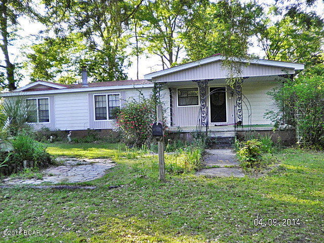 Large 3/2 mobile home on 18+ ac just a short drive from town, this home has lots to offer for the person looking for the quiet country life but still close to town. Very large family room, large living room with fireplace, open floor plan, large master bedroom with master bath, laundry room, double carport with storage building, greenhouse, large barn for tractors and dry storage, open land for farming or farm animals, nice stocked pond for fishing, large oaks, plenty of flowers and flower beds, call agent today to view this home.