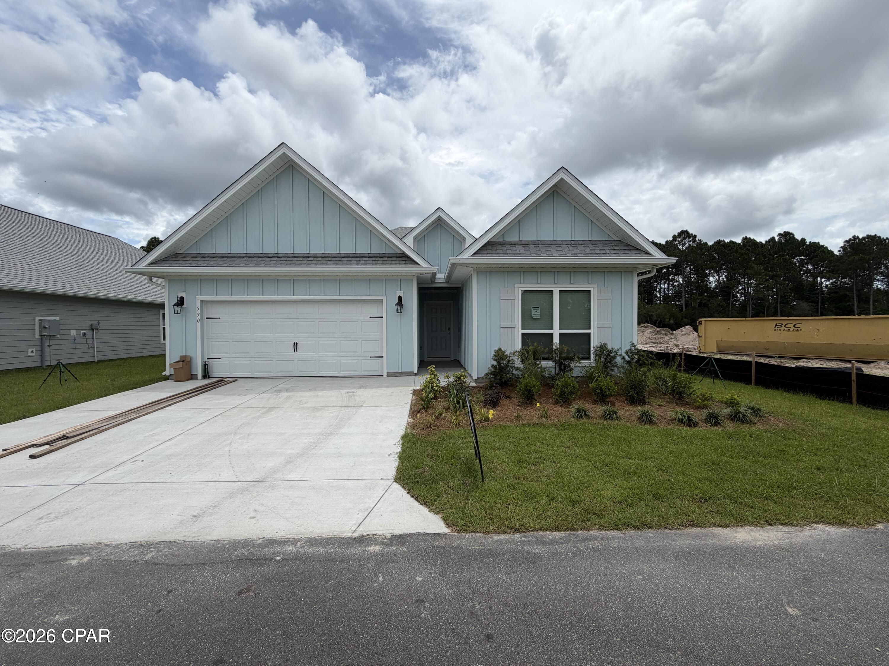New home under construction in Port St Joe. Located at 590 Norris Drive. This homesite will feature the Kennedy floor plan which has 5 bedrooms, 3 full bathrooms and a 2-car garage. Inside you will find EVP flooring throughout, quartz countertops, and a center island in kitchen with beautiful white cabinetry. This kitchen is outfitted with a standard appliance package including stainless smooth top stove, microwave and dishwasher. This floor plan has a formal dining room and features the primary bedroom off the back of the home. The primary bedroom offers a full ensuite with separate shower and large soak tub. This amazing floor plan has a full laundry room that is perfectly sized as a place for additional shelving and storage. If you are looking for the perfect home that is close to all that Port St. Joe has to offer, look no further. Port St Joe Highschool is a short drive away, as well as historical downtown Port St. Joe. If you enjoy water recreation, you will find a public boat launch at Frank Pate Park less than 4 miles away. Homes are subject to prior sale or rent. Home and community information, association fees (if any), included features, terms, availability and amenities, are subject to change at any time without notice or obligation. Drawings, pictures, photographs, videos, square footages, floor plans, elevations, features, colors and sizes are for illustration purposes only and will vary from the homes as built. Landscaping and furnishings may be decorator items not included in the purchase price and may not be available.