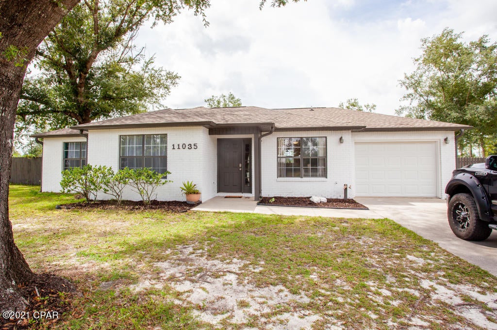 This home won't last long!  Come see it before it's gone.  The home has a 2 year old roof that was put on after Hurricane Michael with gutters, 2 year old AC, butcher block counter tops, stainless farm sink,  1 year old gas stove, kitchen that was remodeled in the last 2 years, a new covered back deck, fenced in yard , chicken coop, 2 year old garage door, new Epoxy kitchen floor (can be tiled or covered with LVP) and more.  You'll love the open concept as you first walk in.  The home offers 3 bedrooms and 2 baths, one of which is in the master bedroom for privacy.  Call before it's gone!