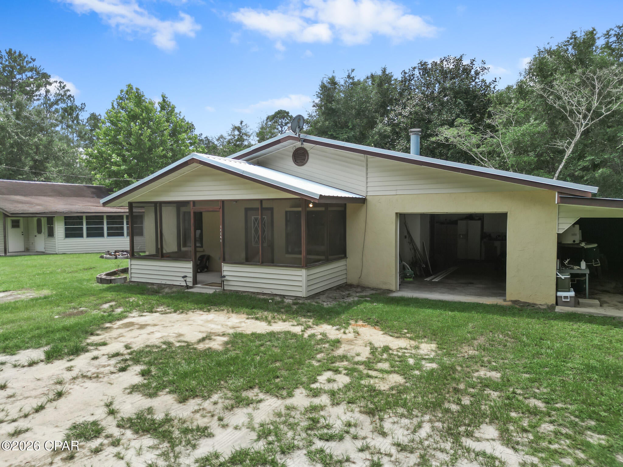 Welcome to your own private slice of North Florida! Situated on 4.82 beautiful acres, this solid concrete home offers the perfect blend of peaceful country living and endless outdoor recreation. Located just one mile from the Apalachicola National Forest, you'll enjoy quick access to thousands of acres of hunting, fishing, hiking, horseback riding, and wildlife, while the Gulf Coast beaches are only about 45 minutes away. 

The home features spacious living areas and provides a fantastic opportunity for buyers to add their own personal touch. A few cosmetic updates will allow you to build instant equity while making the home your own.

Outside, you'll find plenty of room to roam, garden, raise animals, or simply enjoy the privacy that nearly five acres provides. An additional dwelling on the property offers tremendous potential as a future guest house, workshop, or storage building, though it will require significant renovation or could be removed to make way for your own vision.

If you're looking for affordability, acreage, and the freedom of country living with outdoor adventure right around the corner, this property is one you won't want to miss!