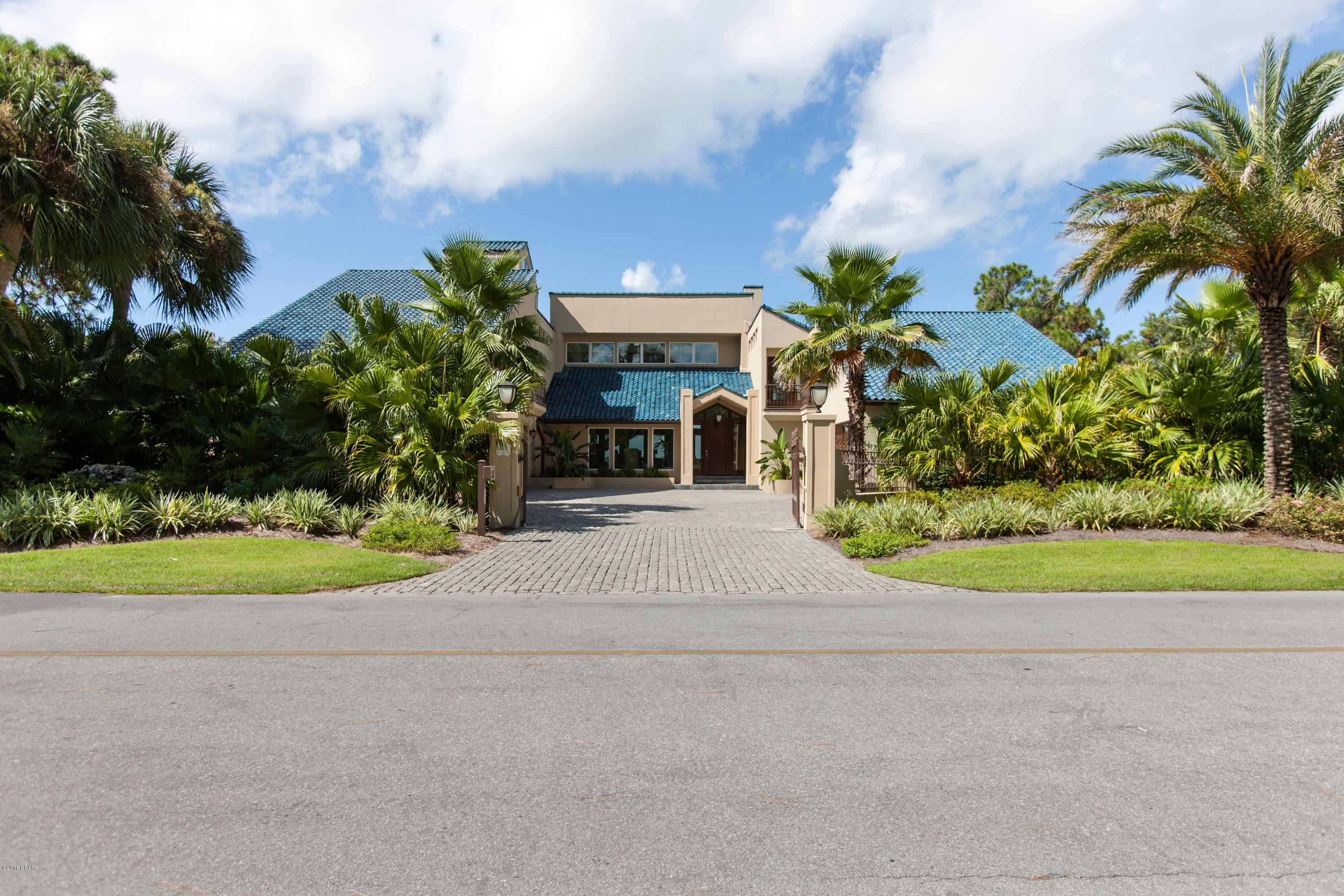 Incredible custom home situated on a large bay front lot in the desirable gated Bay Point Golf and Yacht Club community. This must see home was completely renovated in 2015 at a cost of over $2,000,000 and features exceptional construction, quality materials, with a private gated entrance all on 90 feet of bay frontage and just minutes away from the pass. The formal dining area is adjacent to the living area and the updated gourmet Chef's Exhibition kitchen that will please even the most demanding of cooks that features Sub Zero and Wolf commercial grade appliances throughout, a large center island for entertaining, gleaming marble counter tops and fabulous butler's pantry next to the kitchen has lots of storage and counter space for easy entertaining. Also on this level is the incredible master suite, with a generously over-sized bedroom and sitting area with fireplace, both with bay views, and a luxurious master bath with marble double vanity, jetted tub, separate walk-in steam shower, large walk-in closet with custom built-ins. Step out onto the lanai and enjoy a tropical oasis, resplendent with a sparkling heated pool, hot tub, features include a full summer kitchen, numerous seating and lounging areas surrounded by lush, mature landscaping, gas fire pits and strategically designed outdoor lighting. Private dock conveniently located on a deep water canal with shore power that can accommodate boats up to 70 feet, plus jet ski lifts and bait well at dock for the serious fisherman... This must see, water front oasis is the perfect place to savor the legendary Grand Lagoon sunsets. No expense has been spared on this palatial home! 

Every modern convenience has been provided in this expansive, well-designed floor plan in a jewel of setting. Renovations include: All new exterior and windows, all new interior finishes, new bathrooms including over-sized steam shower in master, new commercial grade gourmet kitchen, new hot water heaters throughout, new HVAC units throughout, upgraded main electrical panel and fully automatic 70 kw commercial backup generator, State of the Art audio visual system, IC Real-time electronic lighting and heating system, State of the Art 16 camera security system with remote access, electronically controlled front security gate, air conditioned garage work area with air compressor, new pool and hot tub, upgraded 90' dock with built in aerated salt water bait-well and twin jet ski dock, and a commercial 30lb. ice-maker.