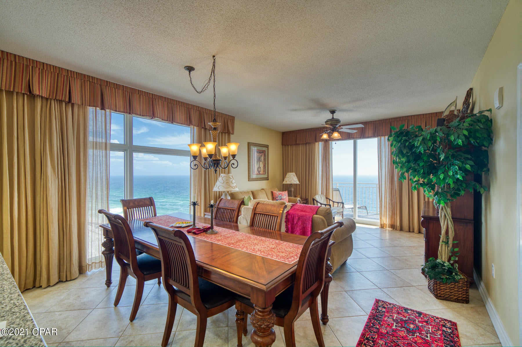 The world class views of the Emerald Coast from this magnificent condo are some of the best in Panama City Beach and make Sterling Reef unit 1601 the beach getaway that you have been dreaming of! Super-efficient floorplan, this oversized 3 bedroom, 2 bath gulf front condo lives like a house but comes with all the benefits of owning a condo! It also has a PRIME eastern corner location in the deluxe 19-story Gulf front complex, offering massive views of the beach, ocean, and Panama City Beach from the kitchen, dining, living area, and all 3 bedrooms! Ample balcony accessed from living area and master suite! This ultra clean, meticulously maintained, turnkey offering offers ceramic tile throughout will convey fully furnished and rental ready. Interior features include a spacious and open floor plan with raised ceilings. Sunrise views in the morning and sunset views in the evening - the ultimate in alfresco living! Property is in immaculate condition and absolutely turnkey - great for second home, vacation rental or full time living. There is plenty of storage throughout this unit with the ample closets and laundry room complete with full sized washer and dryer. Sterling Reef amenities include a heated bi-level pool with connecting waterfall, fitness center overlooking the gulf, clubhouse with media room, video game room, movie rentals, sky BBQ terrace, and the convenience of covered parking in the same building. LOCATION, LOCATION, LOCATION!!!! Directly across the street from Shipwreck Island Water Park, a must for kids of all ages. You can also take your fishing pole right out to the pier. Desk in foyer does not convey.