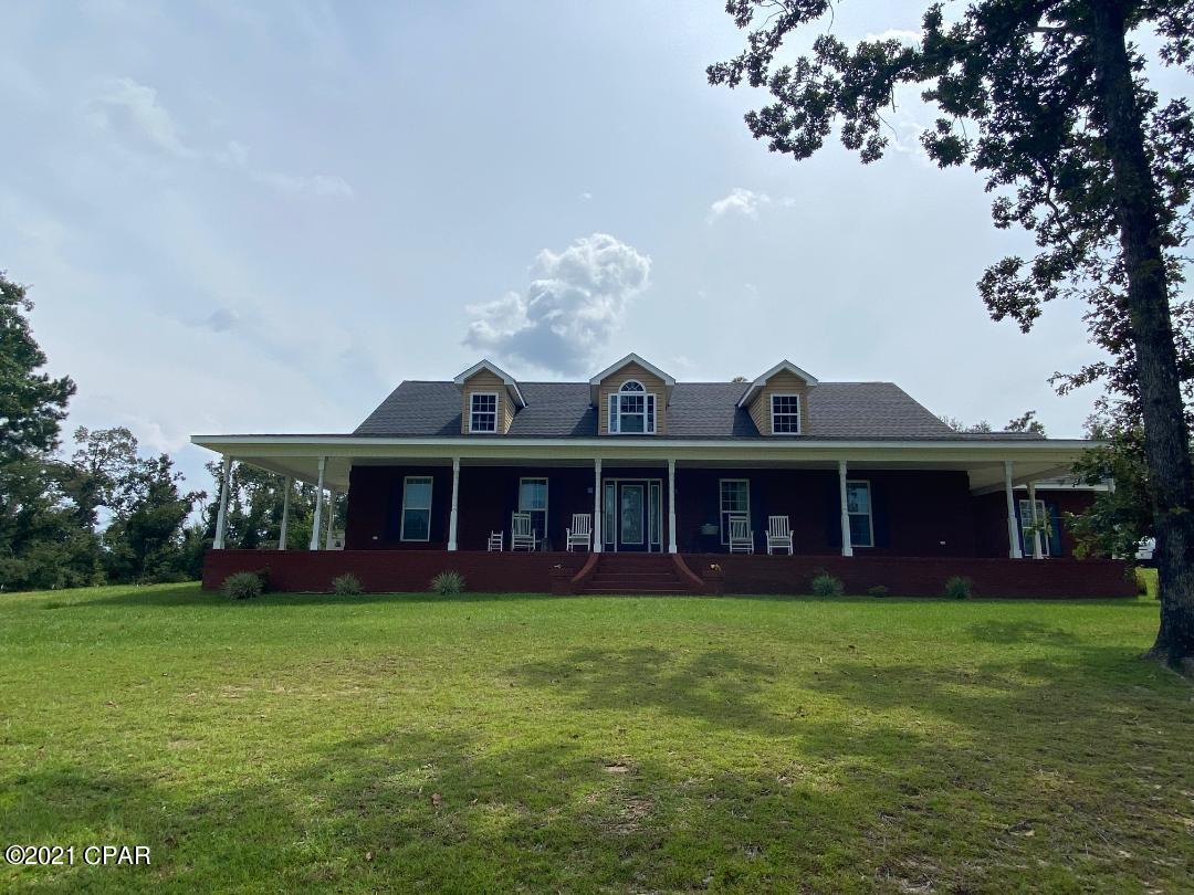 Beautiful home on 5 acres that is completely remodeled!!  Newly shingled roof, two new air conditioners, plenty of attic and storage space, newly remodeled kitchen with granite countertops throughout, laundry room and all bathrooms remodeled.  Come enjoy a dip in this beautiful sports style pool and relax on the large oversized concrete deck (in addition to the tanning ledge and multi colored lighting system).  Multiple home design options - currently a 3/3 with large upstairs room that can be converted into a 5 bedroom 3 bath home if desired.   Large barn with concrete floors with independent power.  There is an animal barn with separate fencing for chickens and calves if desired.  Great spray insulation throughout and affordable utilities.  Attached garage with 1/2 wrap around porch.