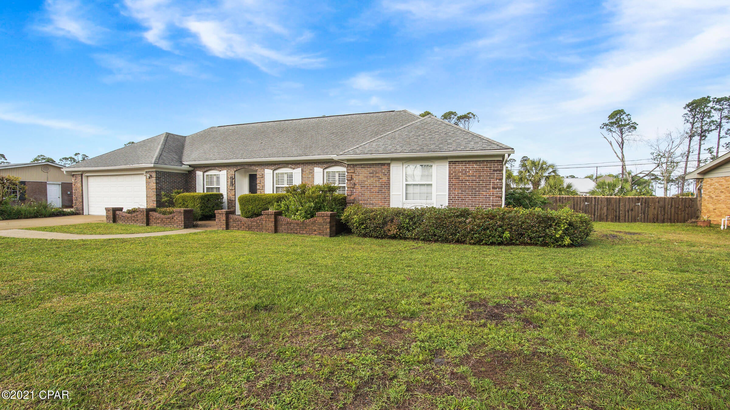 OPEN HOUSE SUNDAY, APRIL 25TH, 1;30-4;00 EST.  Beautiful home located on Monument Drive in Port St. Joe close to the shore of the St. Joe Bay. This very well kept all brick home has 3 Bedroom, 2 baths which has been recently updated. Living room and dining room windows have plantation shutters. 

Kitchen has custom all wood cabinets, granite countertops, hardwood floors, and is open to the den which has a custom fireplace and beautiful crown molding. This home sits on a large well manicured lot. As you are looking out the French doors you can see the St. Joe Bay.   Make your appointment today.
