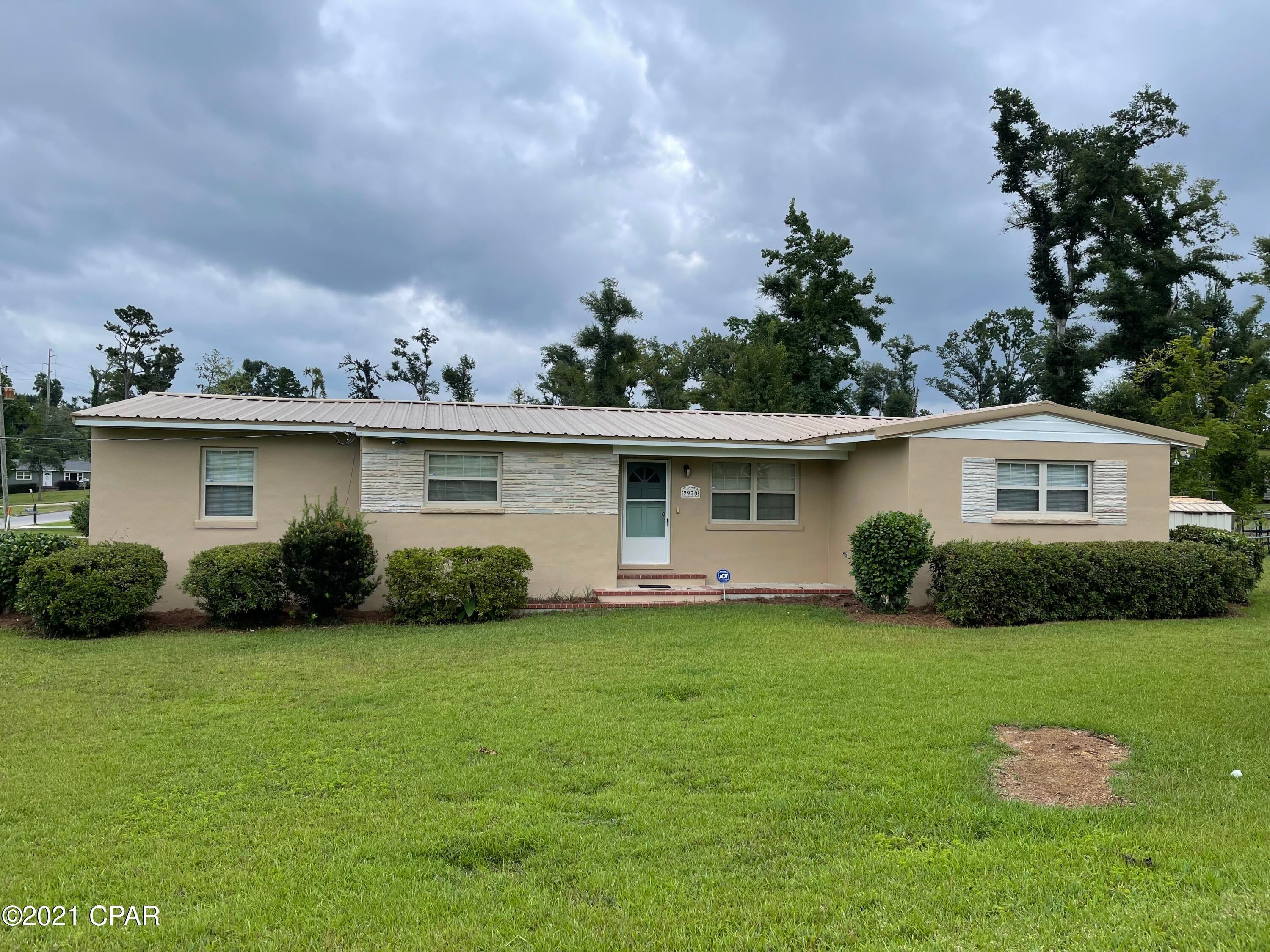 PROPERTY UNDER CONTRACT; OWNER ACCEPTING BACKUP OFFERS. 4 bedroom, 2 bathroom turnkey home in downtown Marianna. This home has been recently updated with granite counter tops, fresh paint and carpet throughout. The home has a split floor plan with master bedroom with en suite bathroom and walk-in closet. The kitchen features white painted wood cabinets, new appliances, and large laundry that could also be used as pantry. The backyard is partially fenced in and has a cute fire pit on the open patio. This home is on a spacious corner lot and would be perfect for a large or growing family! It is in close proximity to Jackson Hospital, Marianna K-8, MHS and other conveniences of downtown Marianna such as shopping and dining.