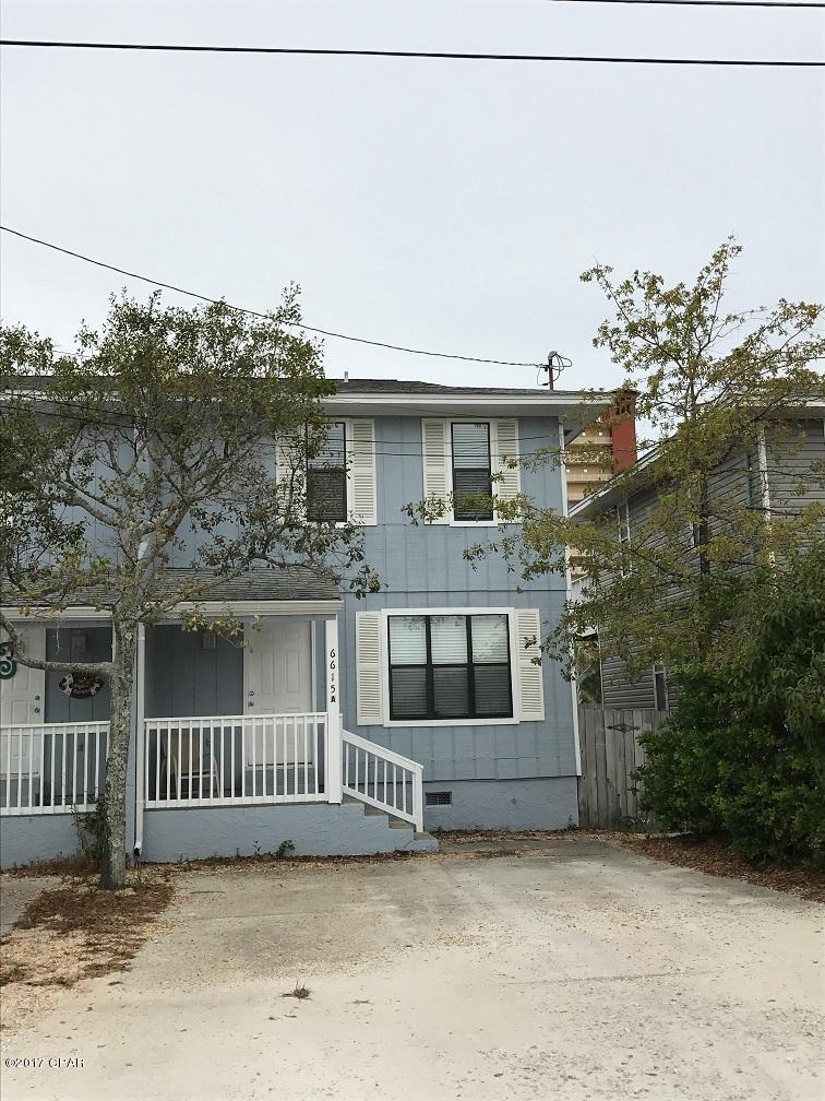 Just a short walk to the beach for this 3 bedroom 1.5 bath town home in the Thomas Drive area. This home feature tile floors downstairs, open patio down stairs, and an open deck off of the 3rd bedroom.