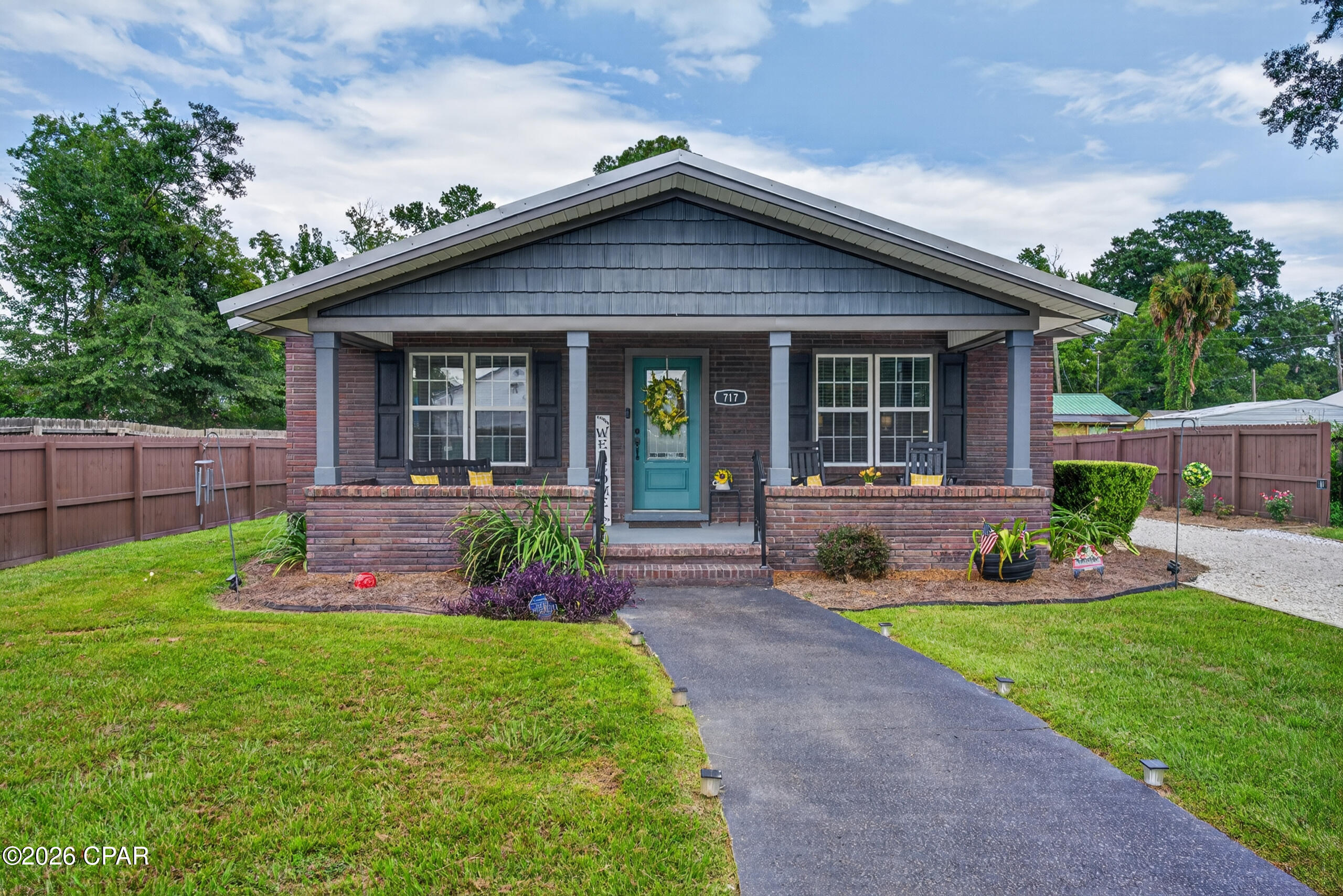 Welcome to 717 Sinclair Street, a beautifully updated 3-bedroom, 2-bathroom home situated on a spacious 0.33-acre street-to-street lot in the heart of Chipley. The fenced yard provides added privacy and plenty of room for pets, outdoor activities, or entertaining. Inside, you'll find durable luxury vinyl plank flooring throughout the inviting living spaces, along with a cozy electric fireplace that creates a warm and welcoming atmosphere. The kitchen features granite countertops, stainless steel appliances, and plenty of space for preparing meals and entertaining. The primary bedroom includes a private en-suite bathroom, while two additional bedrooms provide flexibility for family, guests, or a home office. Additional features include an attached two-car carport, television wiring, and French drains installed by the current owner to improve drainage around the property. Conveniently located near local schools, parks, shopping, and other Chipley amenities, this move-in-ready home is one you will not want to miss.