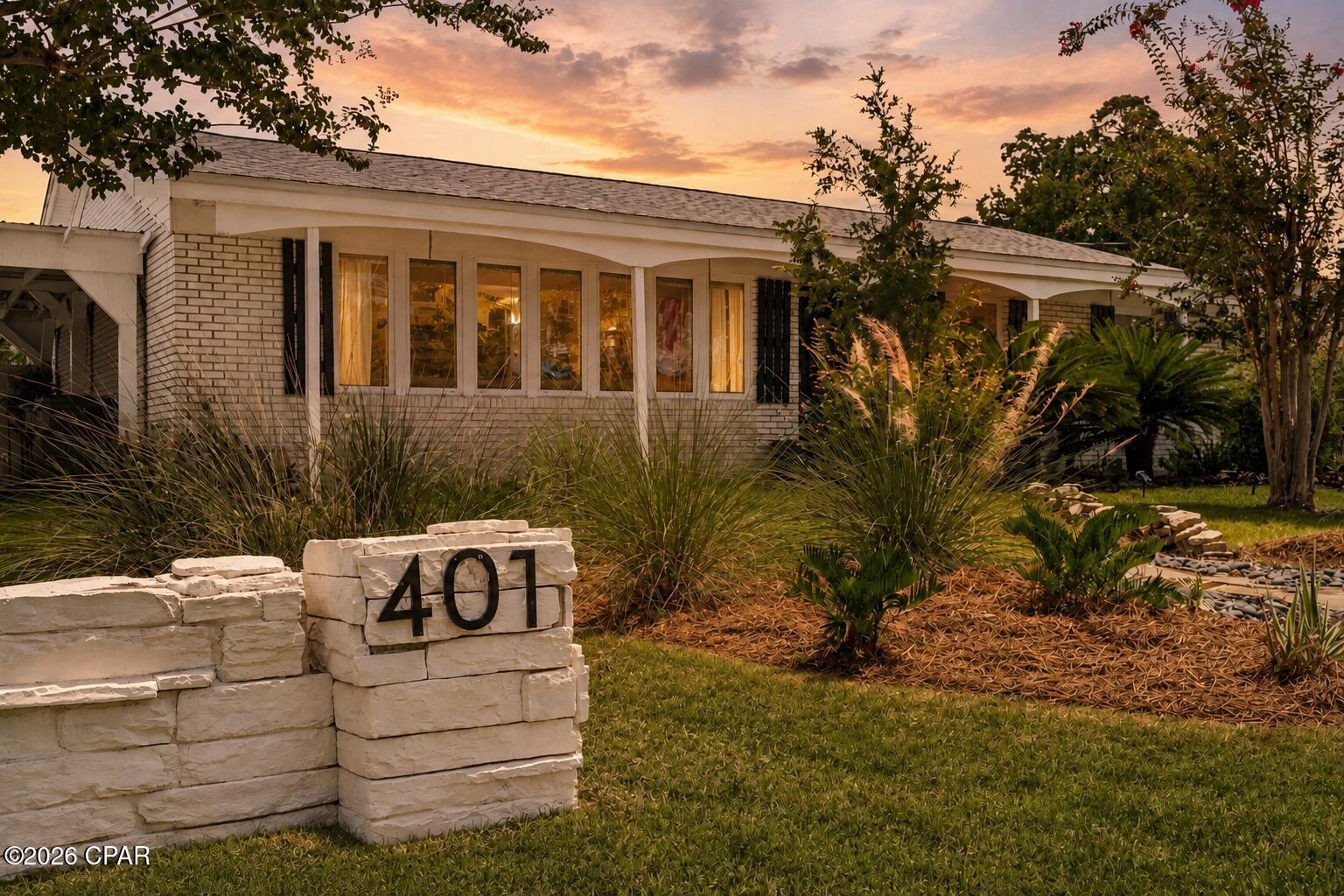 Welcome to a classic single-story brick home situated on more than a quarter-acre corner lot in the heart of Lynn Haven. This three-bedroom, two-bath home is surrounded by beautifully established landscaping, mature trees, and lush green space that creates incredible curb appeal. The roof and windows were replaced after 2018, providing valuable updates to this well-established home. The fully fenced yard offers privacy and plenty of room to enjoy the outdoors, while the oversized side gate makes it easy to bring in a boat, trailer, RV, or other recreational equipment. A massive pole barn with a new concrete slab next to it provides exceptional covered storage for boats, vehicles, outdoor equipment, or virtually anything else you can imagine. With its solid brick construction, generous lot, outstanding storage, and gorgeous setting, this property offers a combination of charm, functionality, and space that is increasingly difficult to find in Lynn Haven.