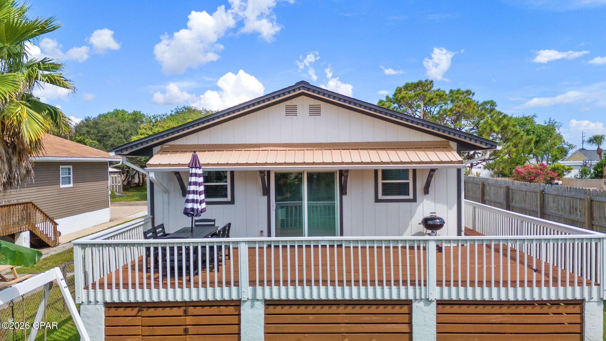 Welcome to 105 5th Street, a charming coastal bungalow tucked away on the desirable west end of Panama City Beach. Located approximately half a block from the Gulf, this 3-bedroom, 2-bath home offers 1,248 square feet of comfortable living space along with convenient access to a private gated beach access.

Inside, classic beach-house character is complemented by thoughtful updates throughout. The updated kitchen features a breakfast bar, pantry, and newer appliances including the refrigerator, stove, and dishwasher. The updated primary bathroom adds a fresh, modern touch, while the home's comfortable layout makes it equally suited for everyday living or a relaxing beach getaway.

Step outside onto the deck, enjoy the Gulf breeze and water views, and embrace everything that comes with living this close to the coast. One of the property's standout features is its proximity to the beach, allowing you to have your toes in the sand within minutes of leaving home.

The west end location puts you conveniently between Scenic Highway 30A and Pier Park, offering easy access to shopping, dining, entertainment, and all that Panama City Beach and the surrounding coastal communities have to offer, while still enjoying a tucked-away residential setting.

Whether you're looking for a primary residence, second home, or investment opportunity, 105 5th Street offers an appealing combination of location, coastal charm, updated features, and exceptional beach access. Come experience the relaxed Panama City Beach lifestyle just steps from the Gulf.