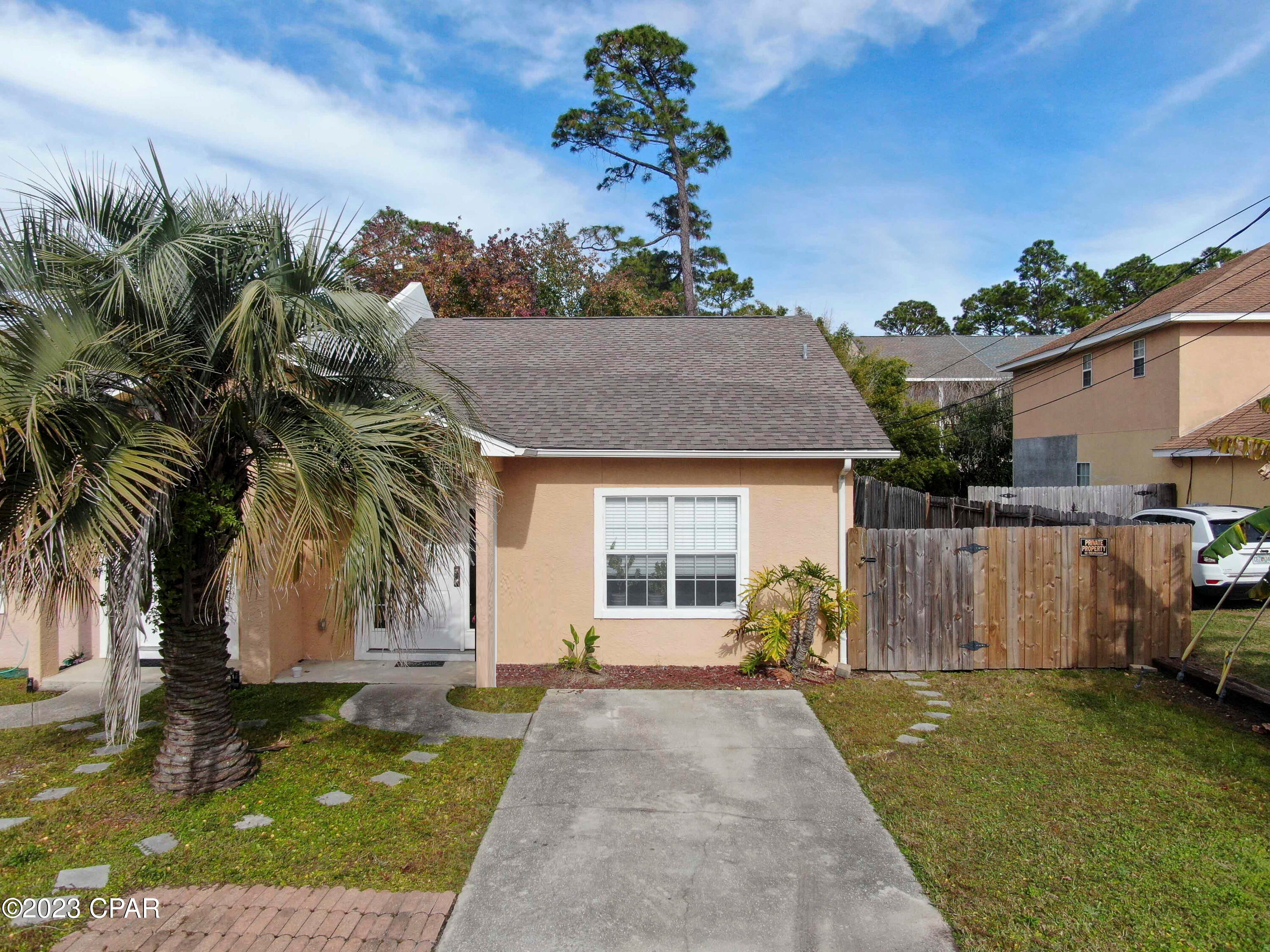 Available February 15th! Embrace the comfort of a charming duplex boasting a back deck and a tranquil garden area. This beautifully renovated residence encompasses two bedrooms, two full baths and is strategically positioned in Panama City Beach—just minutes away from the pristine white sandy beaches, many dining options, shopping, the naval base, Gulf Coast/FSU Collages, and more. Enjoy the convenience of an included washer and dryer. If you're in pursuit of a well-maintained home, your quest concludes here! A minimum one-year lease is required. Unfortunately, dogs can't be accommodated due to the absence of a fenced backyard, but feline companions are welcome. Yard service is included in rent, and tenants bear responsibility for all utility costs.
