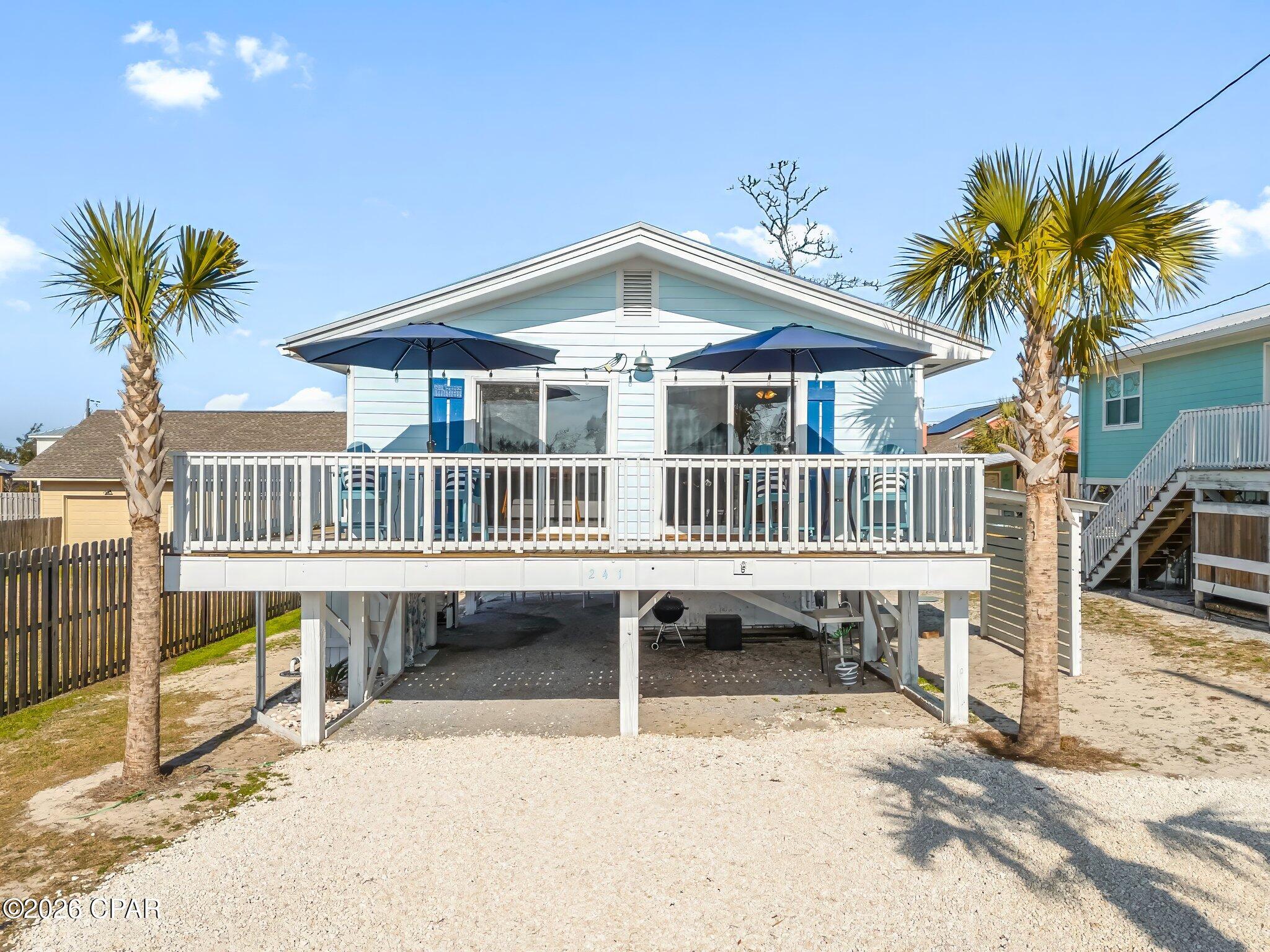 Whether you're looking for a cozy primary residence by the beach, a relaxing vacation getaway, or a turnkey short-term rental investment, this charming 2-bedroom, 1-bath cottage offers the best of coastal living. Just a short stroll from the sugar-white sand, you'll love ending your days with gorgeous beach sunsets before heading home to unwind.

The fully furnished home is move-in ready and ready to rent from day one. Inside, you'll find granite countertops, luxury vinyl plank flooring, a new HVAC system, ceiling fans throughout, and an updated kitchen with a GE gas range, LG Studio French door refrigerator, Frigidaire dishwasher, GE microwave, and double sinks. You will also enjoy a new washer and dryer, fresh paint in the bedrooms, and tinted windows to help reduce electric bills.

The outdoor living space is sure to be a favorite gathering spot. Roast marshmallows or tell stories around the fire pit, watch the game on the outdoor TV, play corn hole, ping pong, or giant connect four, grill a tasty dinner, grab the pickleball paddles and cruise to the pickle courts, or relax in the comfortable seating area after a day at the beach. Don't feel like cooking?  Walk to the local restaurant around the block. 

An outdoor shower and toilet make cleaning up after sandy adventures easy, while the storage shed provides plenty of room for beach chairs, bikes, or even kayaks.

This property has proven rental appeal with approximately 65% winter occupancy and 90-95% occupancy during peak season. With actual 2025 short-term rental income of $53,000 and projected  income of $60,000+ annually, it's an excellent opportunity for investors while still being the perfect place to create your own beach memories.

Come tour this cozy home today!