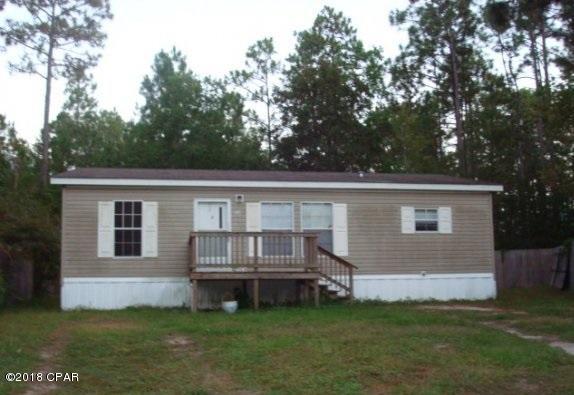 Needs new roof, skirting, carpet, minor misc interior repairs. Tenant pays $695 per month. 3 bedroom 2 bath double wide mobile home convenient to schools, shopping, and Tyndall AFB. Great investment property.  Call for your private showing today!