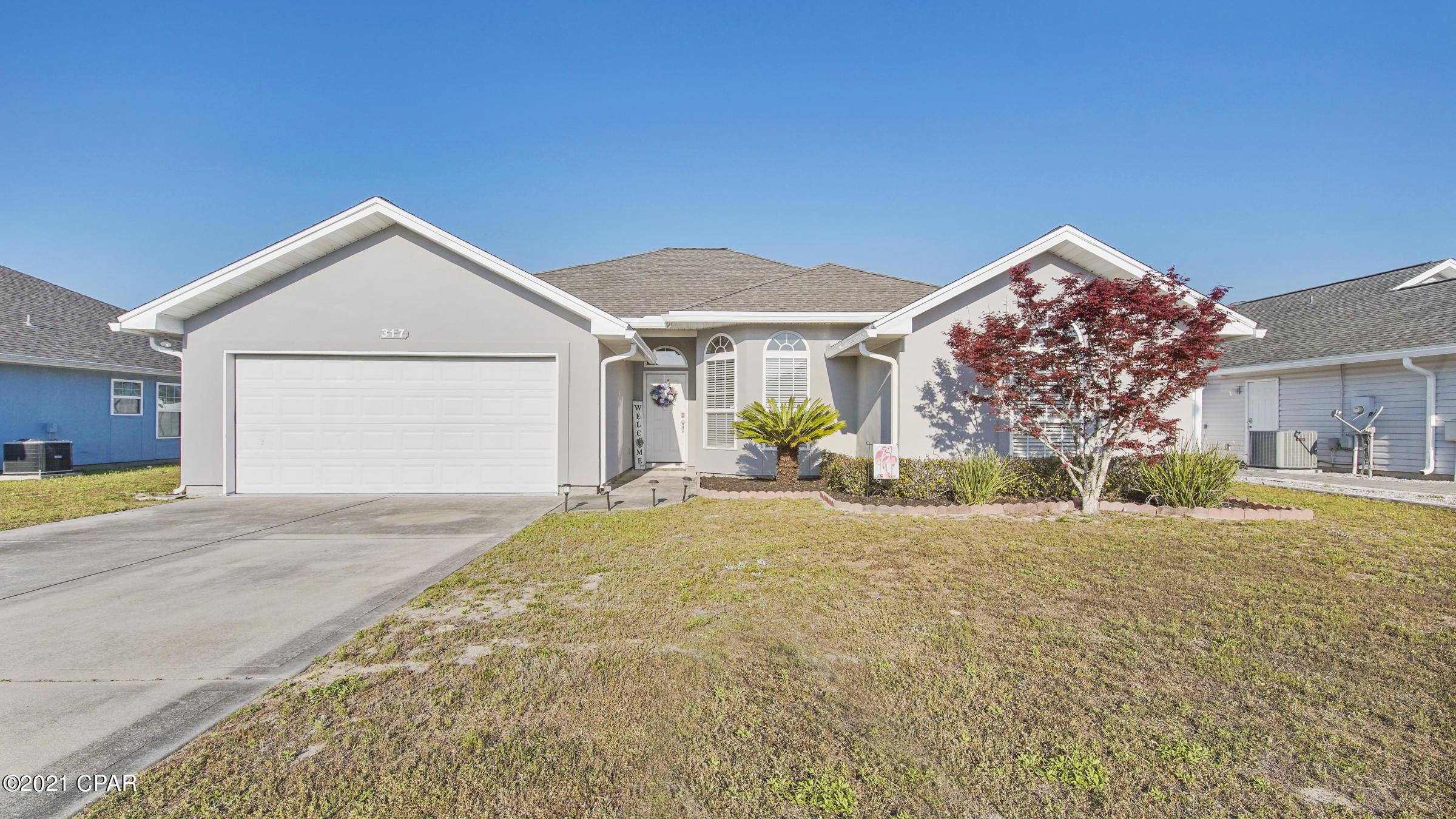 Beautiful must see home in the quiet community of Forest Walk. You'll love the privacy and separation of the split bedroom floor plan. As you enter, you'll notice the bright and airy living room that opens in to the dining room and kitchen. The master bedroom  is just off the living room and has lvp floors, tray ceilings. The en suite is sure to please with double vanities, walk in shower, soaker tub, and two walk in closets. There are 3 additional bedrooms in the front hallway, which share the hall bathroom. Enjoy the spacious backyard that's enclosed with a privacy fence. New roof and A/C installed in 2019. 

This home is close to Tyndall AFB, schools, parks, ball fields, shopping, and the beautiful beaches. separate location from the other bedrooms and view of the front yard and street. Tile is throughout the major traffic areas, kitchen and bathrooms for easy cleanup. The large kitchen is stylish and functional with Corian counter tops and beautiful wood cabinets. The open family room has high ceilings and space above the cozy fireplace to for an entertainment center. The breakfast bar and room is a perfect place for that quick meal or snack. The foyer opens into the formal dining room with beautiful lighting and large windows looking out onto the front yard. Enjoy your morning coffee or BBQ, rain or shine, under the large cover back porch. The roof is scheduled to have new 30 year dimensional shingles installed in time for closing. Pull right into the spacious two garage with automatic opener to unload your groceries or kids in any kind of weather.