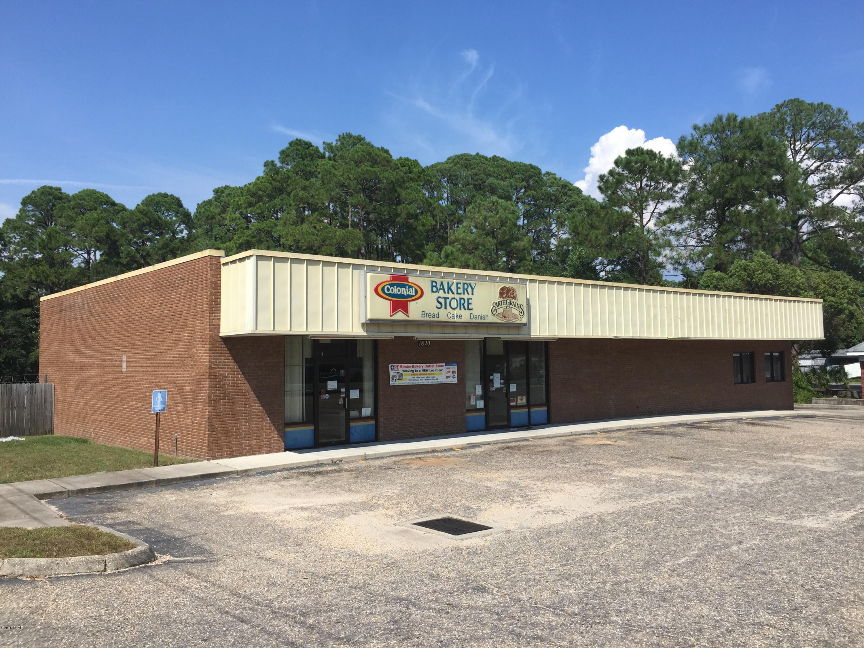 A free-standing building possessing retail showroom/ office space and warehouse. The current configuration provides for a 2,000 +/- sf retail showroom/ sales area with drop ceiling. The attached warehouse portion is approximately 2,800 sf with 12' clear ceiling and 15 over-head roll-up doors loading areas. 14 loading areas as at 24'' above grade with one door at 4' above grade providing for semi-trailer access. There is one restroom in the warehouse portion and a 500 +/- sf walk-in cooler. In addition there is approximately 800 +/- sf of office/ training area. There is one large conference/ training room approximately 575 +/- sf and two (2) private offices, restroom and storage room. The subject property is a corner parcel, centrally located on busy Highway 98 a/k/a West 15th Street. Located at the northeast corner of Highway 98 & Fortune Avenue. The property possesses full access from Highway 98 and additional ingress/egress points on Fortune Avenue. Highway 98 is one of the area's main commercial thoroughfares with daily traffic counts of 29,500 +/- VPD.