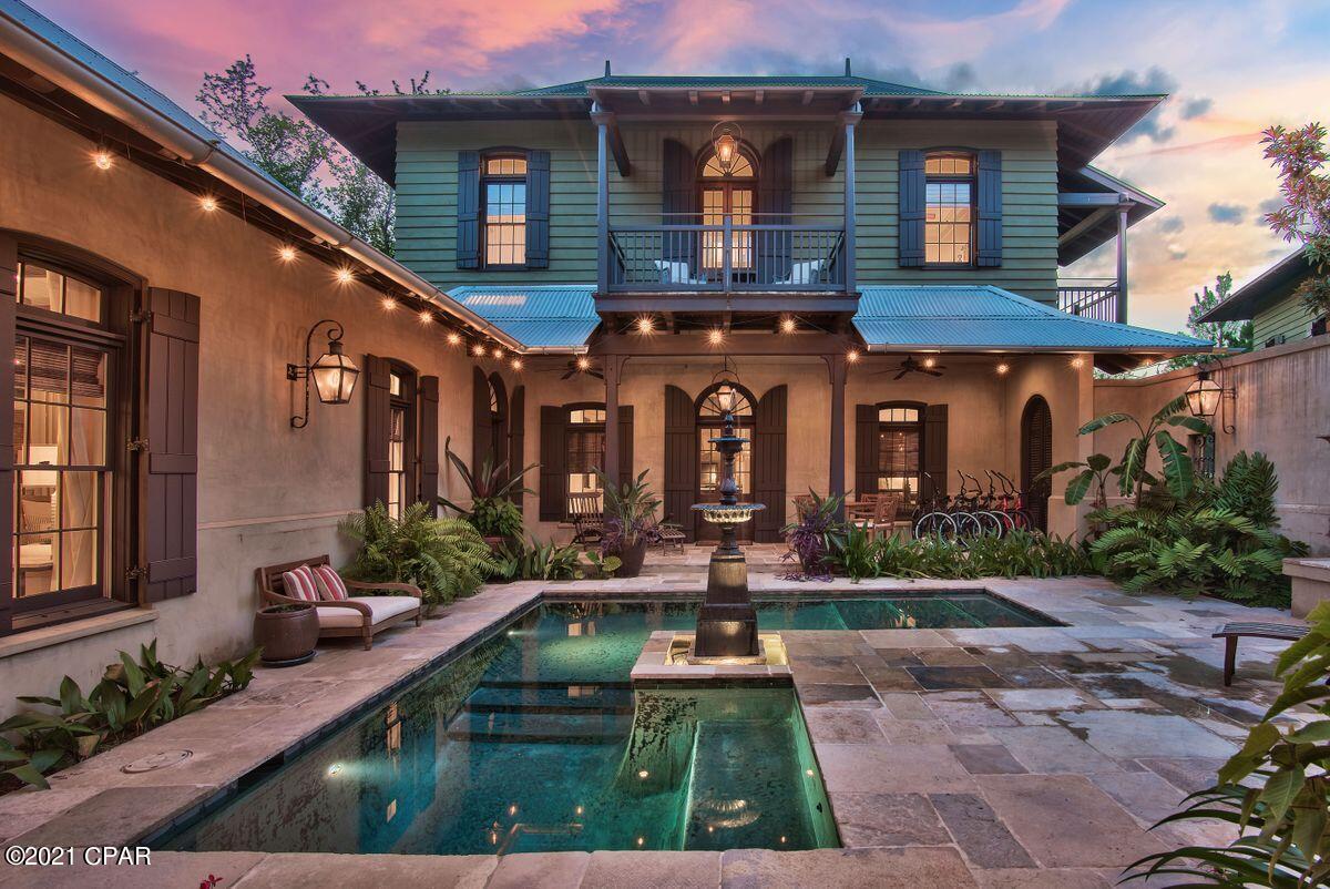 CURRENTLY UNDER CONTRACT, SELLER ACCEPTING BACKUP OFFERS. Colonial Home on Spacious Homesite Featured in Veranda Magazine, this extraordinary British Colonial Style home was thoughtfully designed by Charrette Design Group. Situated on one of the largest, most private homesites in Rosemary Beach this 4,584 sq.ft. complex is brimming with bespoke architectural features. Antique French limestone floors, custom mahogany woodwork and antiqued plaster walls lend the feeling of ''Old World'' charm. Beneath the darkwood beams in the living room, put your feet up in front of the cosy Isokern fireplace with its custom mantel. Natural elements and stylish transoms create an elegant yet casual touch throughout the property. and full size wine cooler. It's a well appointed space, whether you're entertaining on a grand scale or just making pancakes for two. Walk out through mahogany French doors onto the shady veranda where lounge chairs invite you to relax and listen to the tinkling fountain. The serene courtyard setting draws the eye to the L-shaped black-bottom pool and outdoor fireplace. Low maintenance flagstones enhance this peaceful area of quiet contemplation, lit by flickering gas lanterns after dark. Sharing this exceptional space with visiting family and friends is a pleasure. This spacious home has a guest wing offering privacy on the main and second levels. A separate sitting area with two of the three guest bedrooms have balconies creating a pleasant environment to sit and read while overlooking the lush courtyard and pool. The master suite has its own wing with a private balcony and bright sitting area. In addition, there's a guest cottage separated from the main house by the walled courtyard which creates a private sanctuary. Spaciously designed over three floors, the cottage easily sleeps 9 with two guest suites and two bunk beds. Guests can enjoy their own independence with a gourmet kitchen, dining area and laundry. This prime accommodation could also be used for an independent family member, house manager or to generate income as a vacation home or long-term rental. Behind solid wooden gates there's ample parking for both the main house and the cottage. The unspoiled sandy beach, upscale dining and entertainment at Rosemary Beach are just a short stroll from the door, making this unique residence an absolute 'must see'.